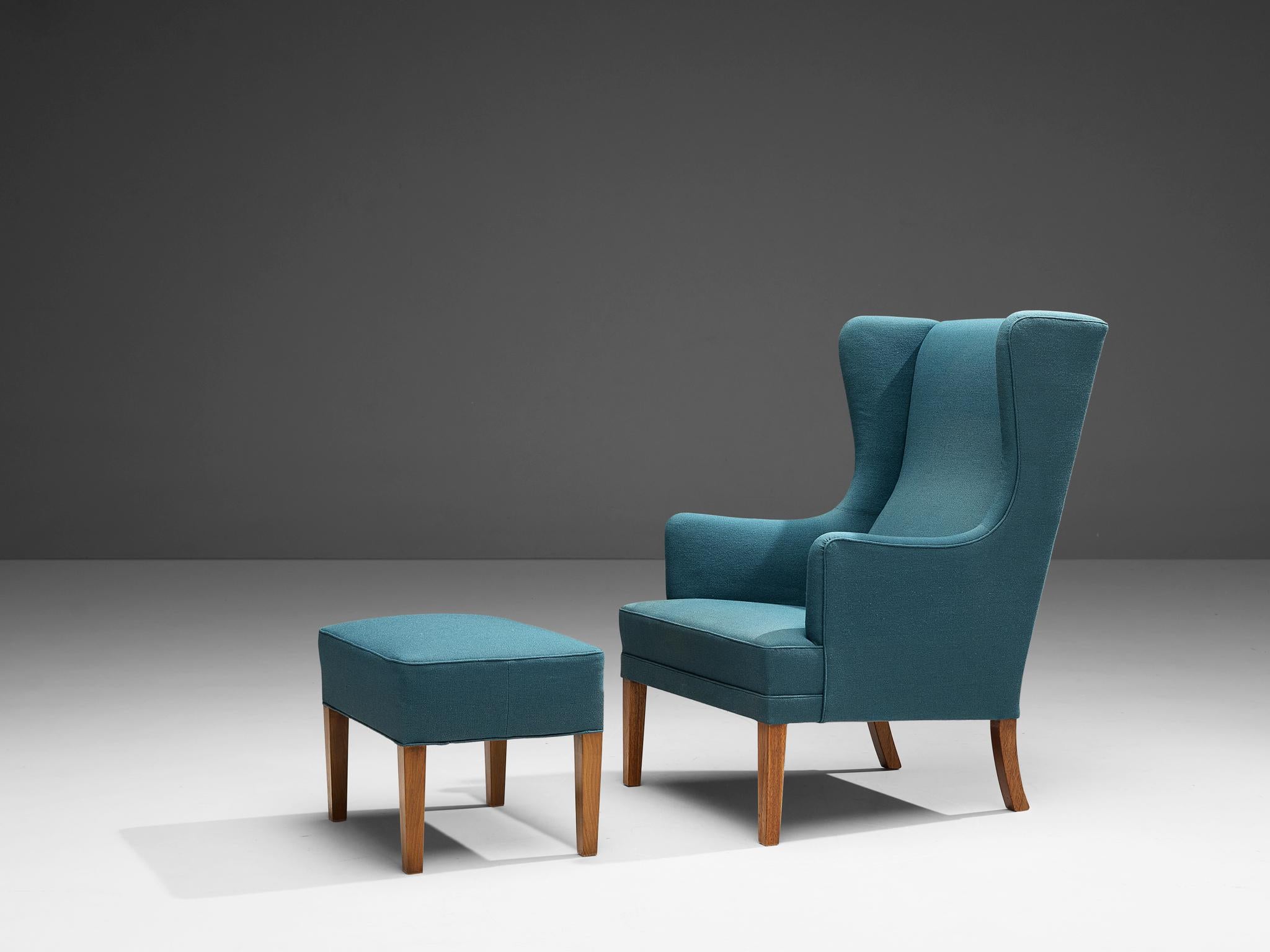 Armchair, fabric, oak, Denmark, 1950s.

This archetypical wingback chair and ottoman of the 1950s is both extremely comfortable and pleasing to the eyes. Soft edges, tilted shapes and muted colors make this a truly mid-modern armchair from Denmark.