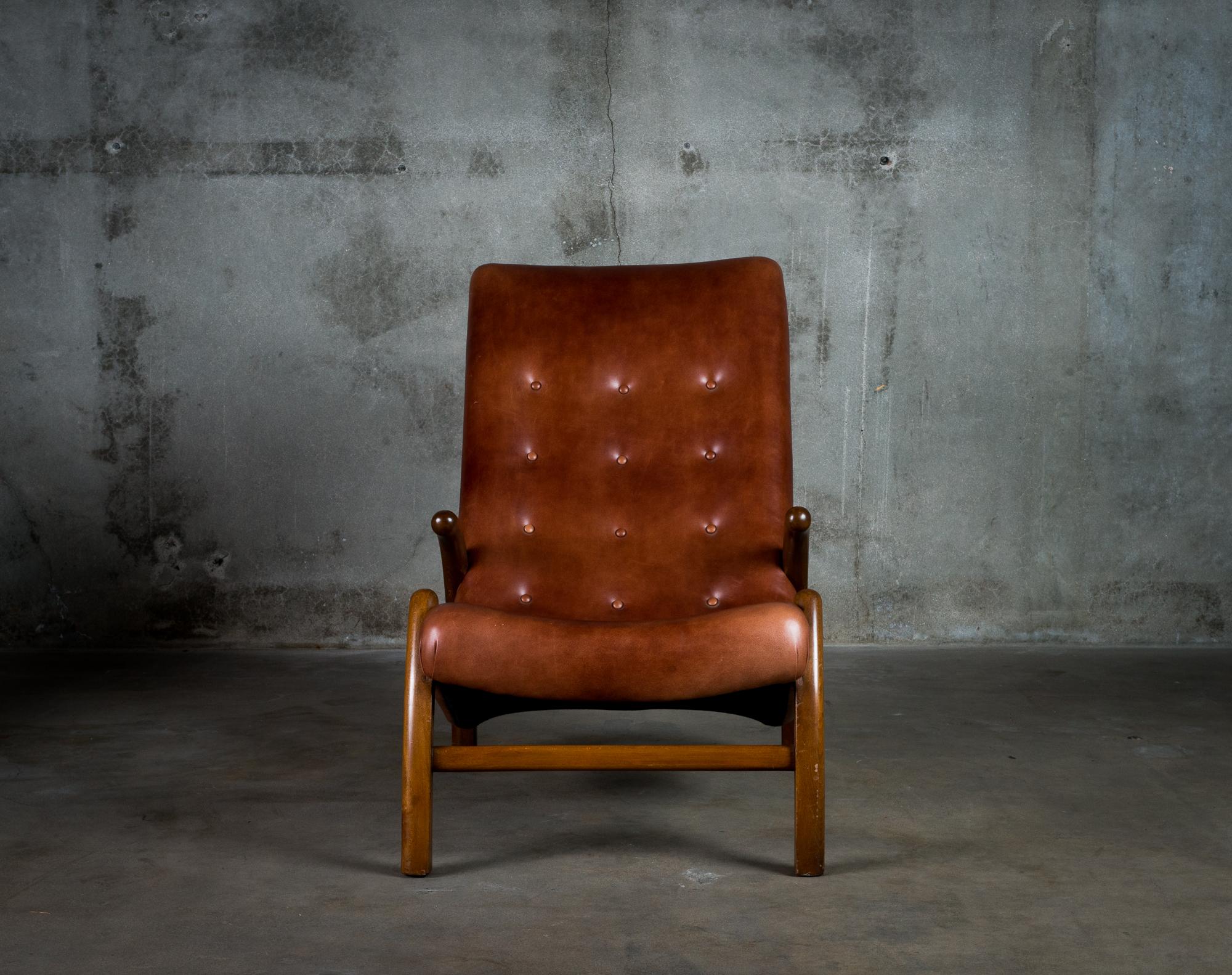 One leather upholstered lounge chair from Denmark, 1950s.