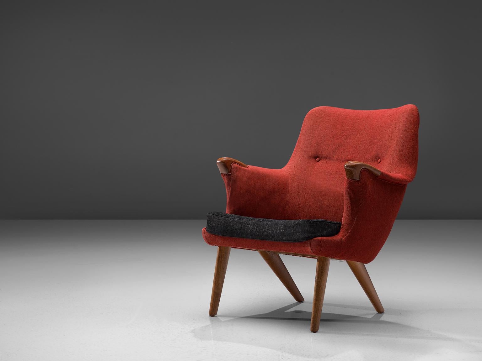 Danish armchair, oak and red fabric, Denmark, 1960s.

This lounge chair has an open expression and an elegant shape due to its round shapes. The armrests have flow loosely in the seat, giving the idea of someone spreading its arms towards another.