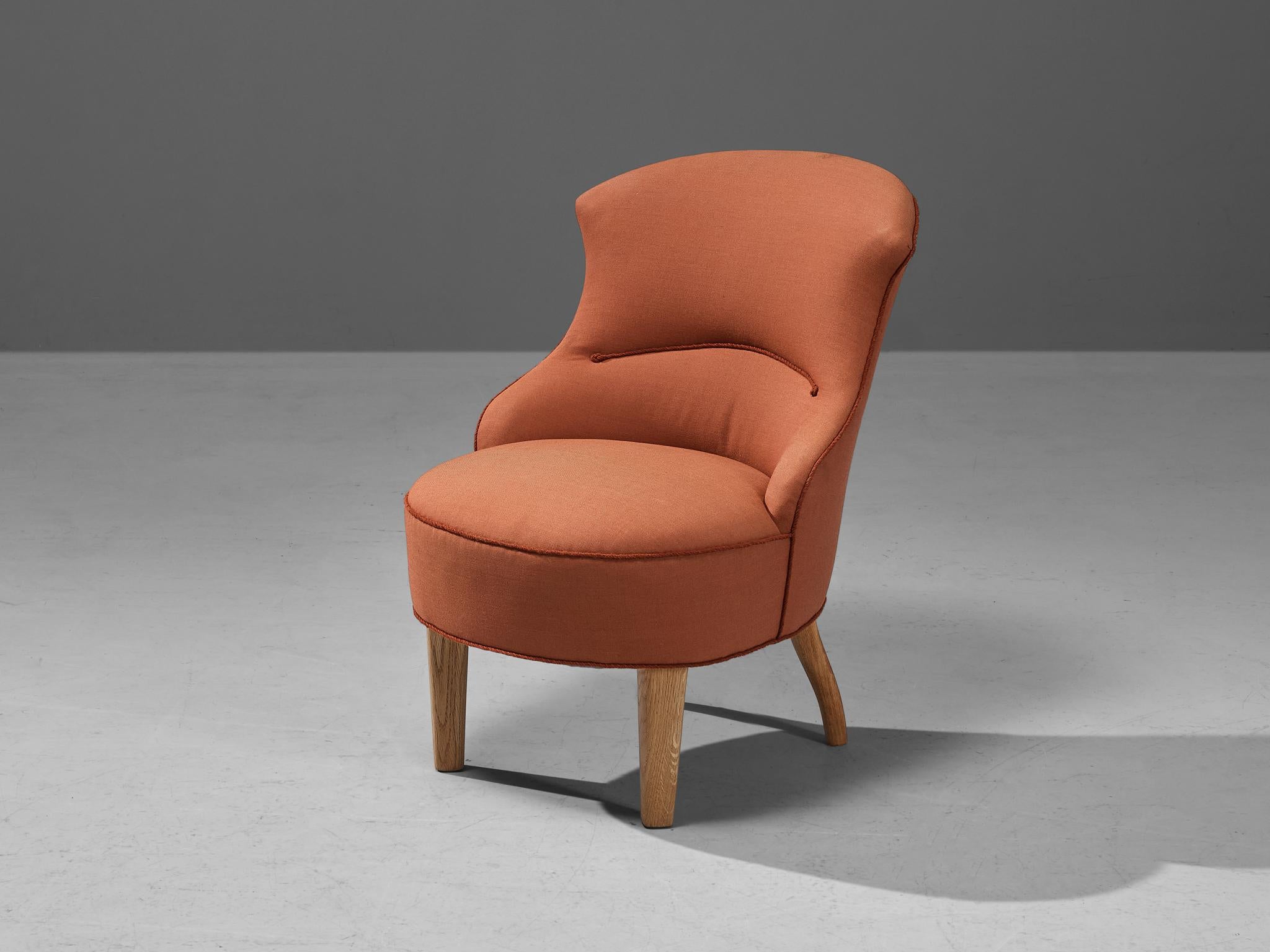 Easy chair, oak, beech, fabric, Denmark, 1960s 

This classic lounge chair of Danish origin features modest and subtle lines and shapes that emphasize the clear construction of the design. The designer decided to stay modest with decoration by
