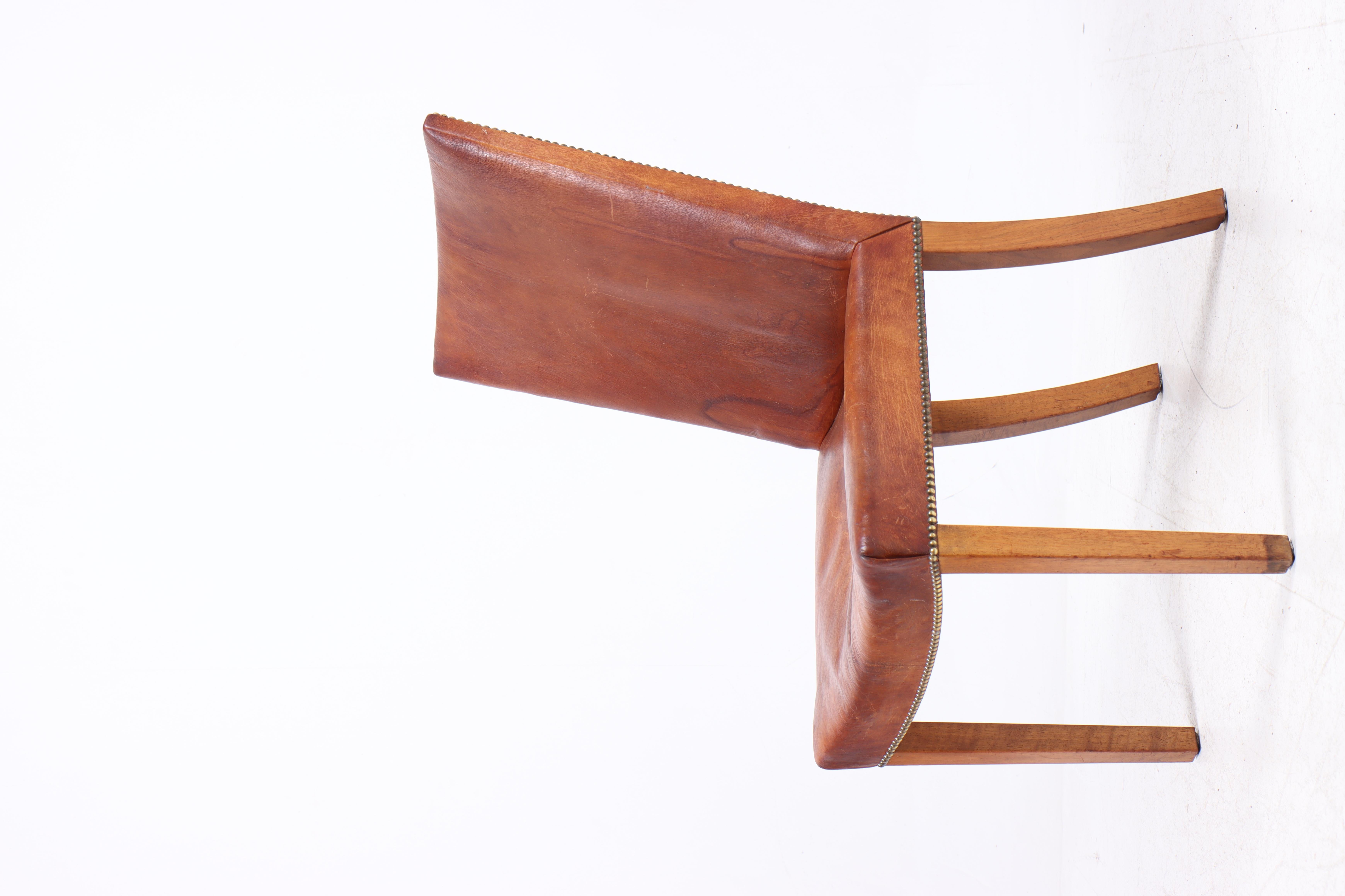 Danish side chair in patinated Niger leather and mahogany. Designed and made in Denmark, great original condition.