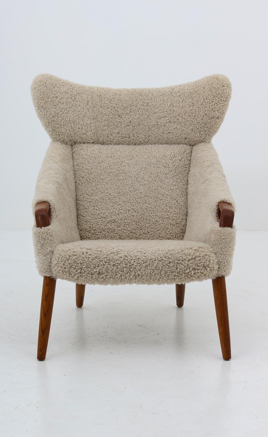 Teak Danish Lounge Chair in Sheepskin, Model 55 by Kurt Østervig