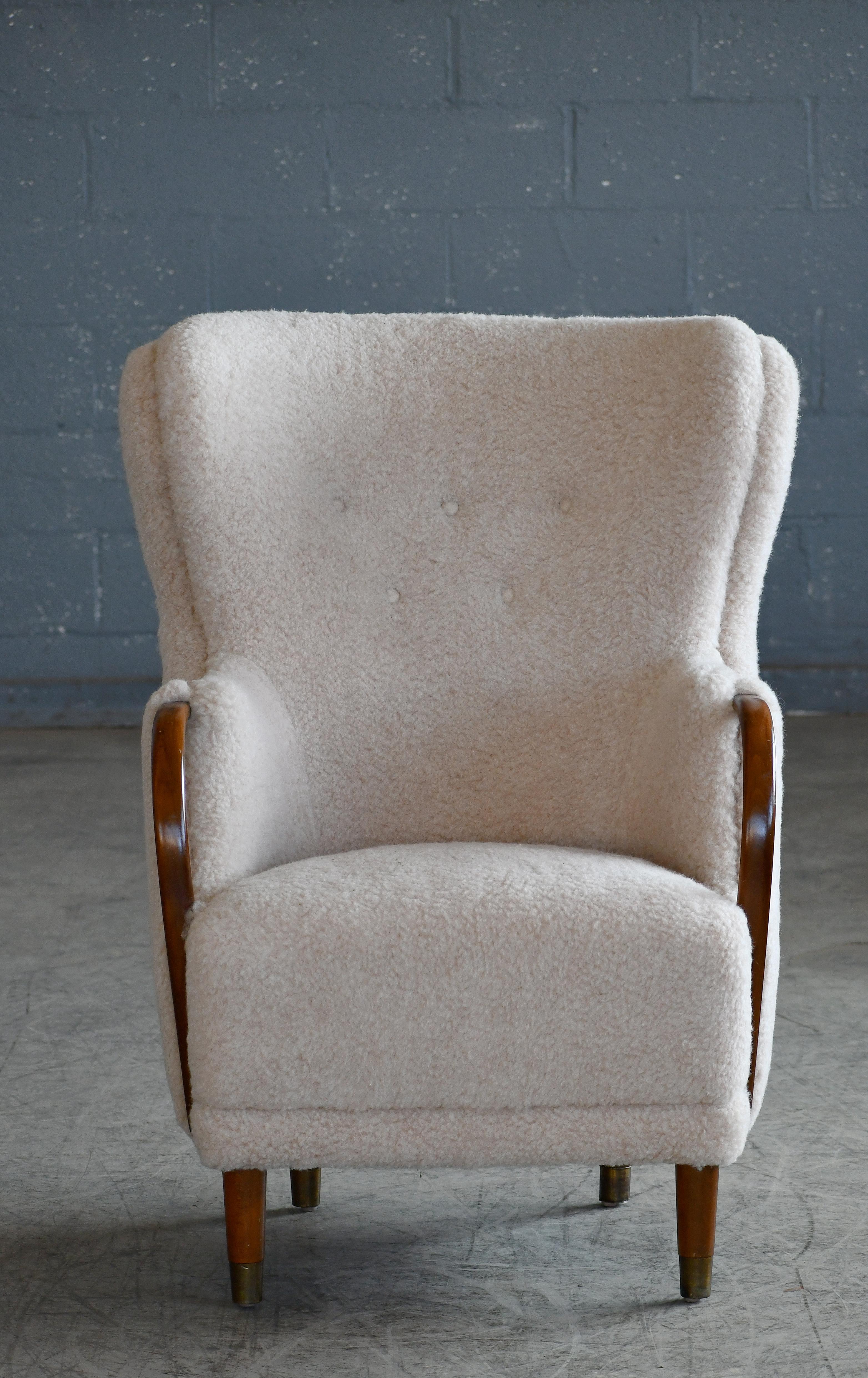 Unique and just superb curved armchair with open armrests designed and made as Model 96 by N.A. Jørgensens Møbelfabrik in 1954-1955. Very rare find. N.A. Jørgensen is better known under the name Bramin Mobler a name they adopted in the 1960s.