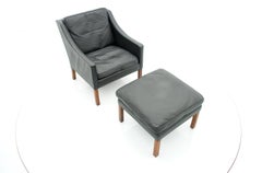 Danish Vintage Lounge Chair with Stool in Black Leather 1960s