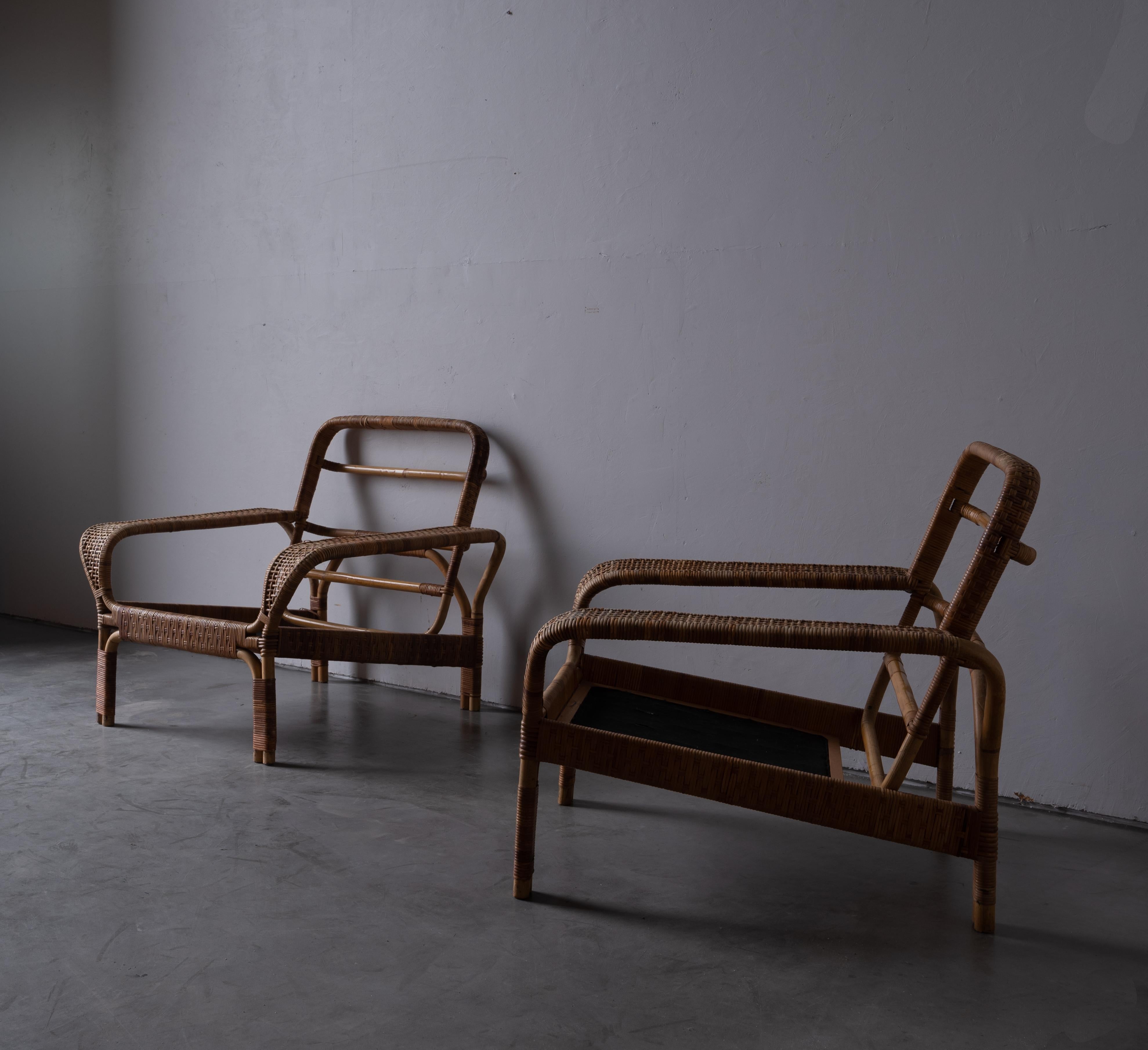 A pair of lounge chairs. Designed and produced in Denmark. 1940s.

In moulded bamboo with rattan / cane details. Without seat cushions, will need custom made seat cushions.

Other designers of the period include Gio Ponti, Jean Royère, Henry