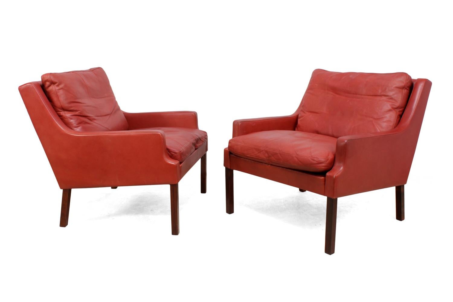 Mid-Century Modern Danish Lounge Chairs in Red Leather with Stools For Sale