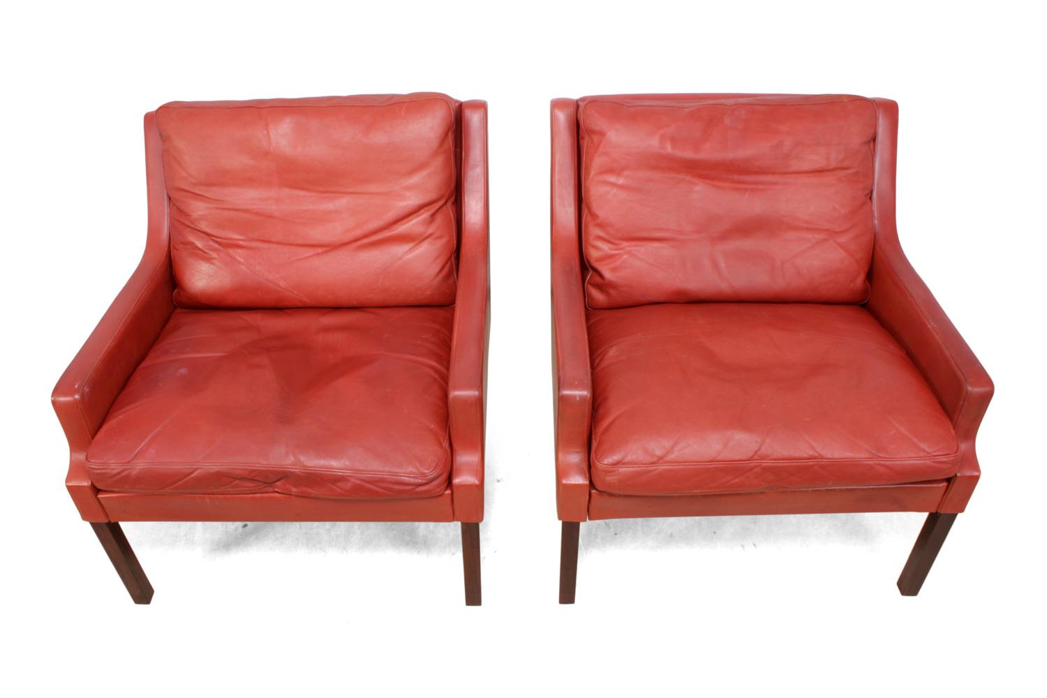 Mid-20th Century Danish Lounge Chairs in Red Leather with Stools For Sale