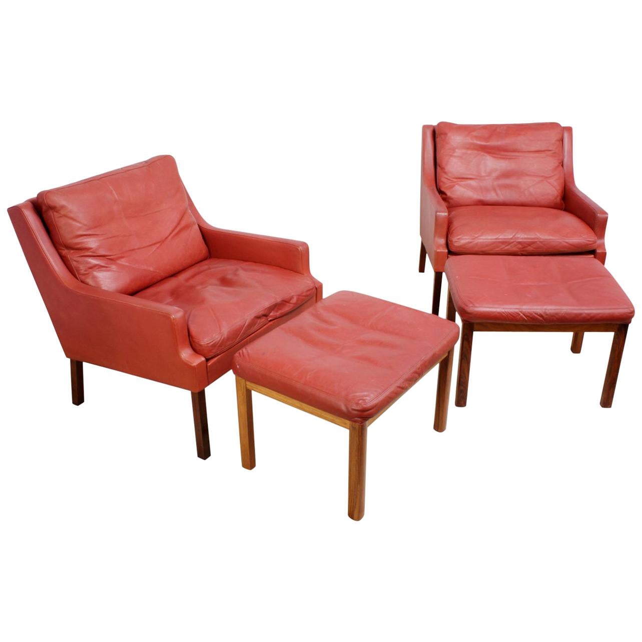 Danish Lounge Chairs in Red Leather with Stools For Sale