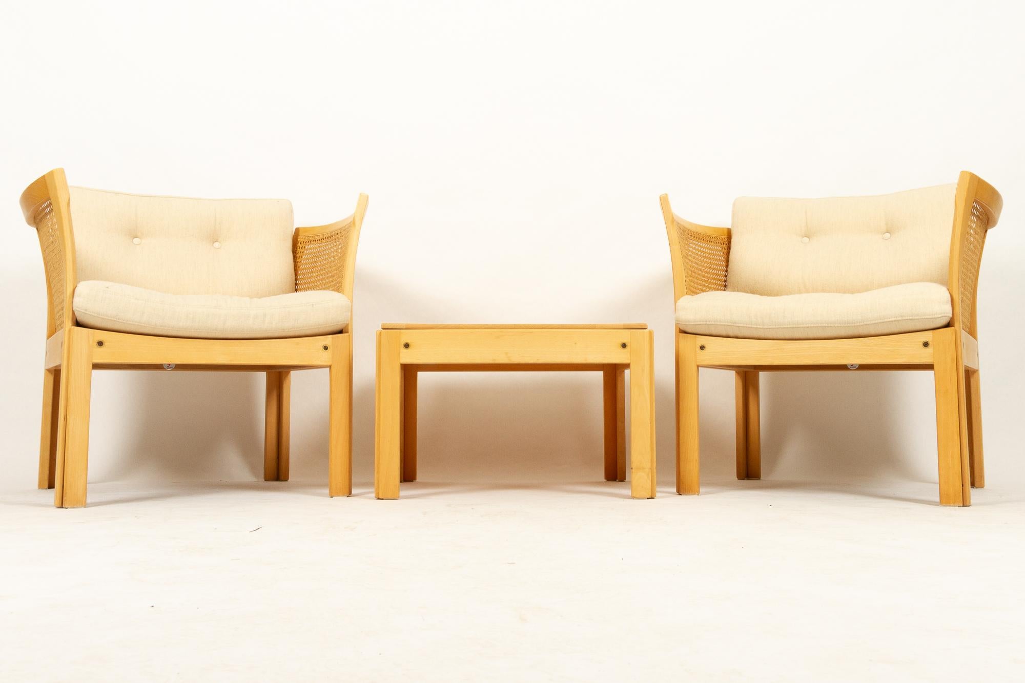 Danish lounge set plexus by Illum Wikkelsø for CFC, 1980s. Nordic light style.
Set of two elegant and light lounge chairs in beech with matching side table. Very comfortable easy chairs with sides and backs in braided cane. Cushions in soft off