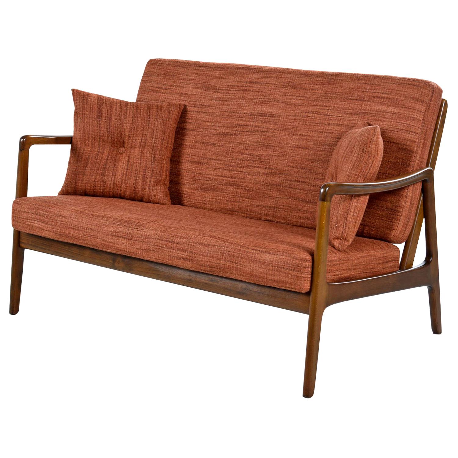 We are pleased to present this rare Danish settee by Ole Wanscher for Fance & Daverkosen. Collectors will recognize these names as Ole Wanscher is one of the most sought after names in Danish Modern design. This loveseat size sofa from maker France