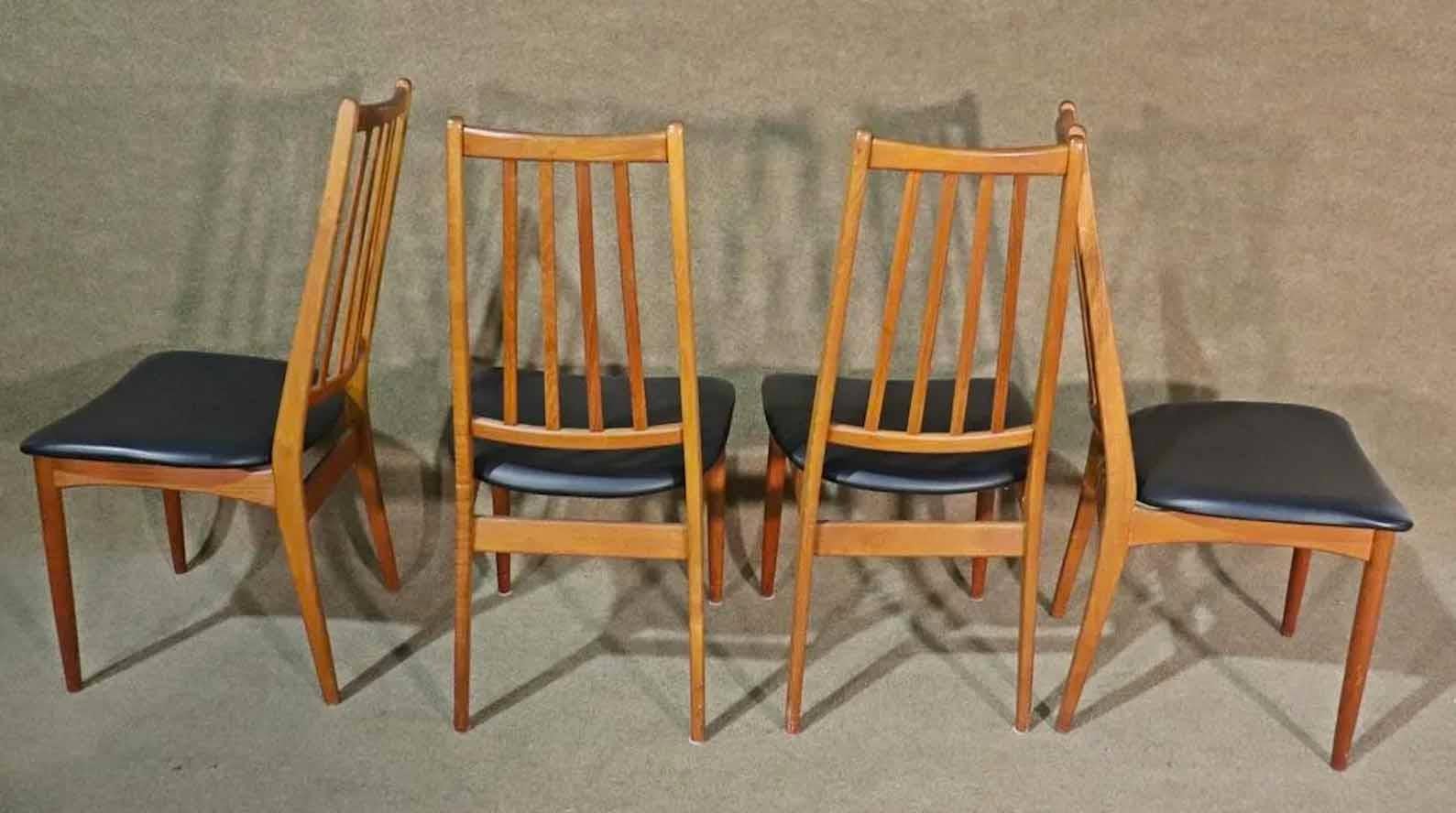Mid-Century Modern dining chairs from Denmark. Teak wood frames with slat backs and floating vinyl seats.
Please confirm location.