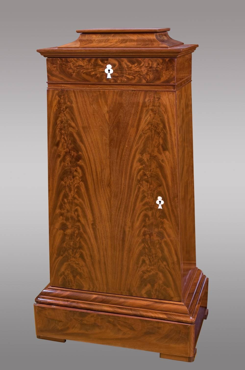 
Danish cabinets of trapezoidal shape with drawer on top, door with shelves and hidden drawer in the base,
19th century.

