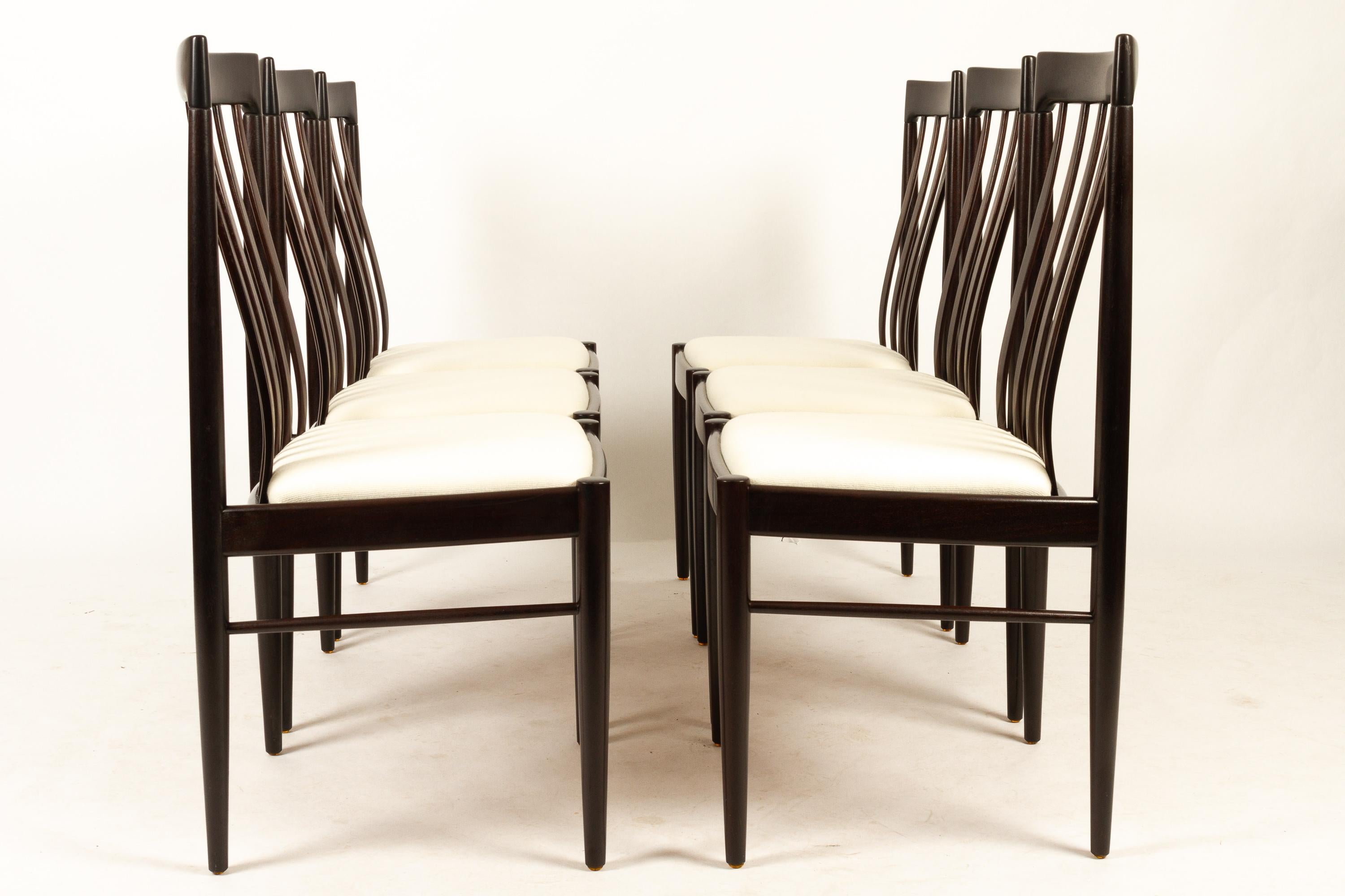Danish mahogany dining chairs by H. W. Klein for Bramin 1970s set of 6.
Set of six elegant dining chairs in solid stained mahogany. High back with thin curved bars. Seat is reupholstered in eggshell colored wool, with high density foam for extra