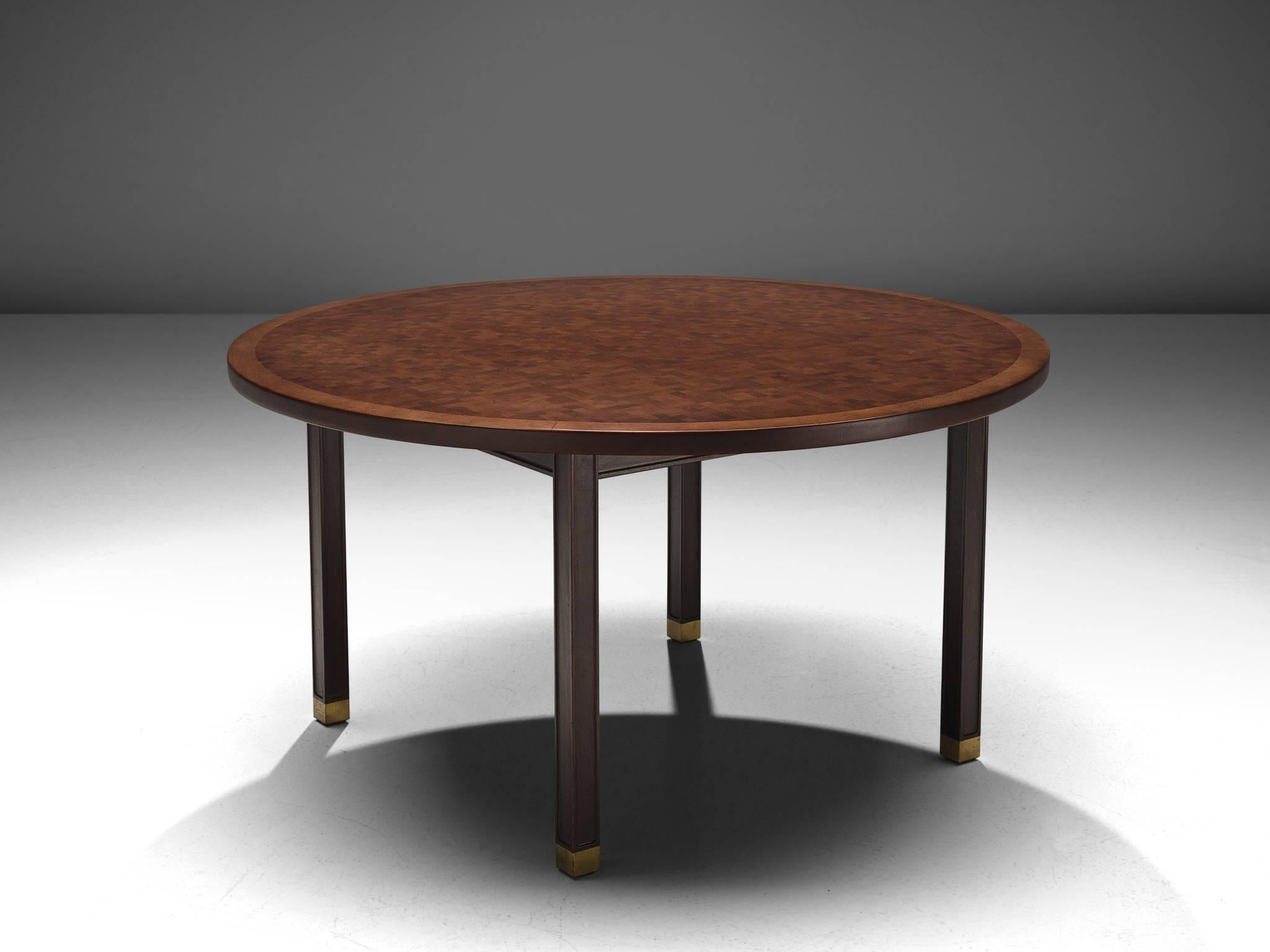 Gorm Lindum, dining table, brass and mahogany, Denmark, circa 1970.

This inlaid centre table by Gorm Lindum has mosaic structured tabletop, that consist of cubical pieces end-grain mahogany wood. These pieces vary both in color and pattern and by