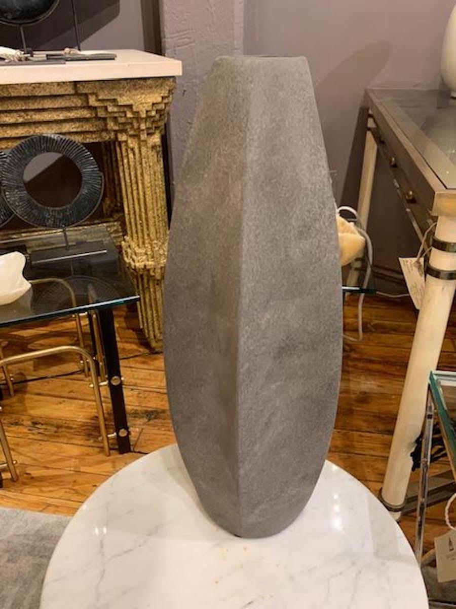 Contemporary Danish design thin tall ceramic vase
Matte grey glaze
One of a collection of many shapes and sizes.