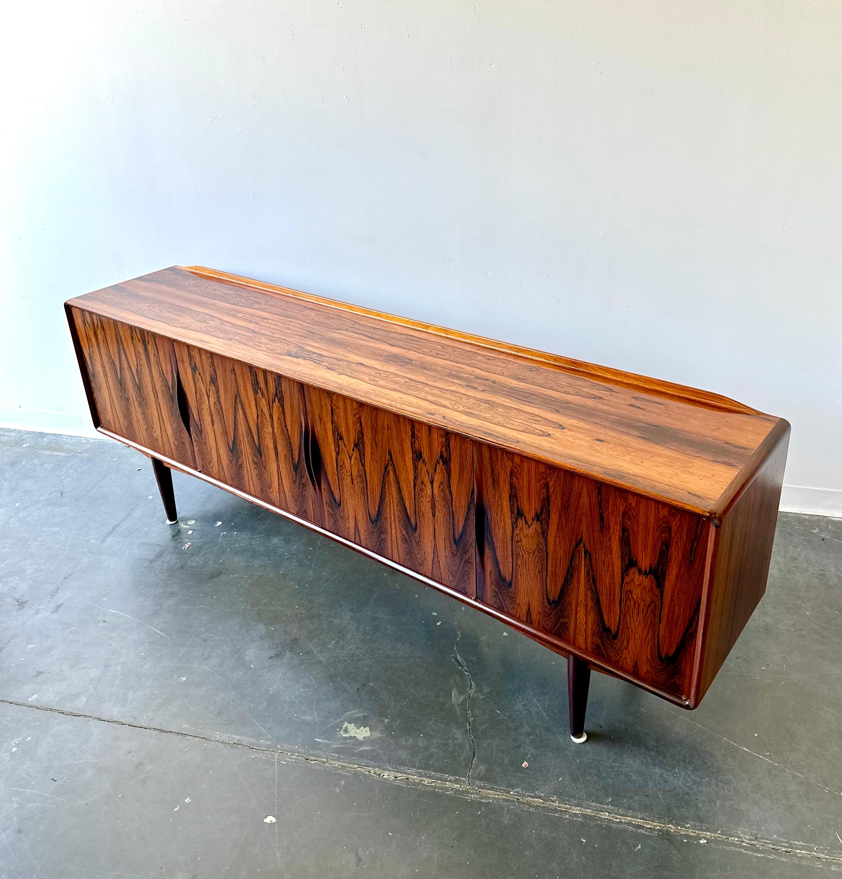 Outstanding long Danish rosewood sideboard by Alf Aarseth.

Fantastic condition with minor wear.  This Scandinavian piece is the finest quality with excellent wood grain.

Dim:

88” W 18” D 32.5” H