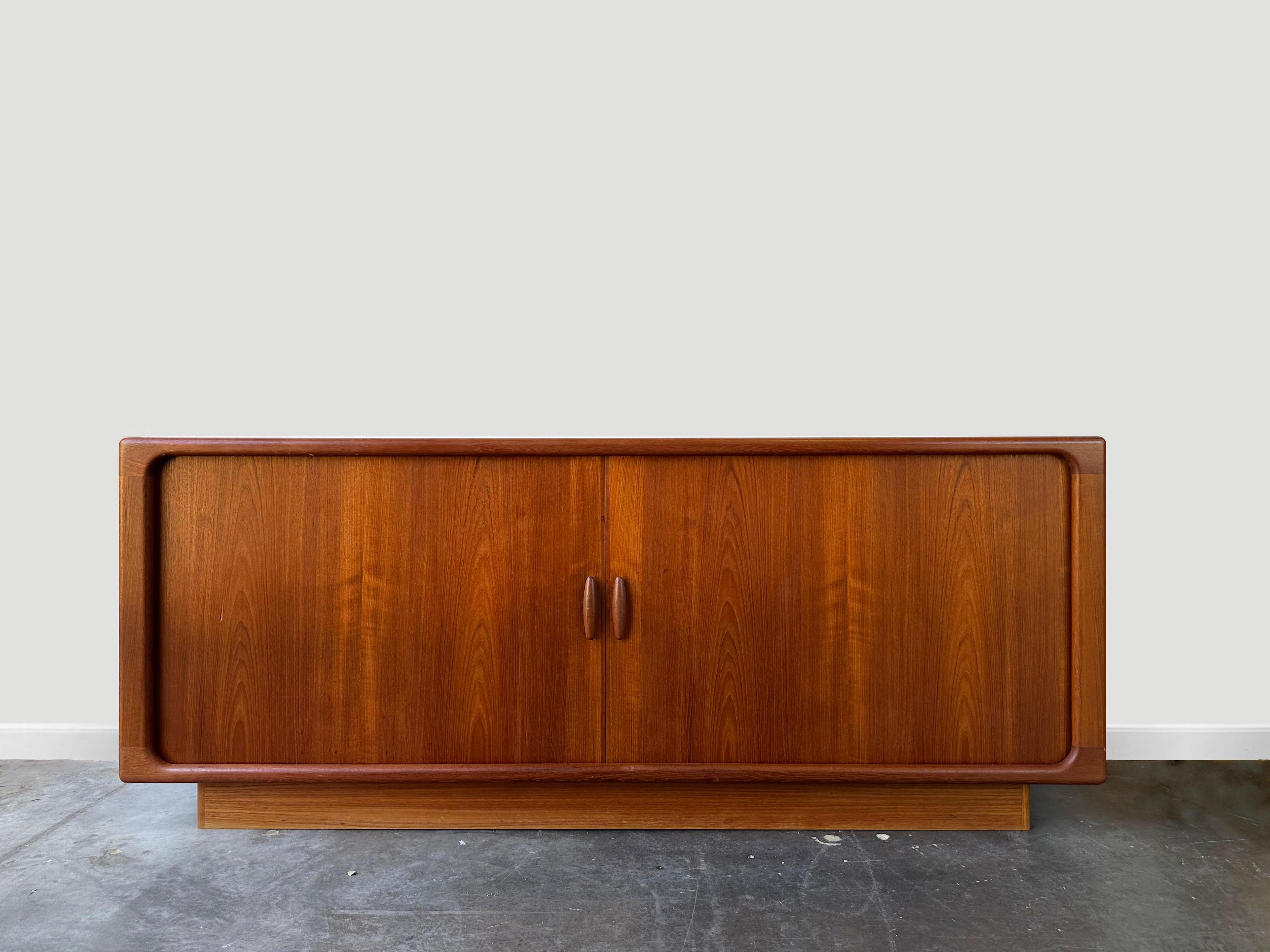 Scandinavian teak sideboard

Manufactured by Dyrlund circa 1970.

This piece features curved edges with tambour door.   Doors open to expose three drawers in the center and two open sides with adjustable shelves.


The cabinet is in excellent