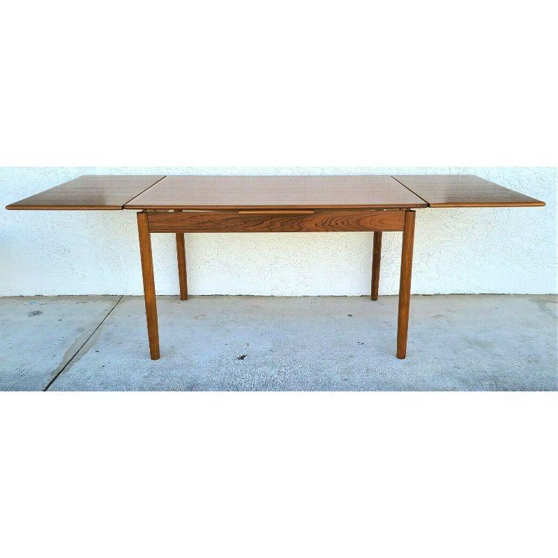 For FULL item description click on CONTINUE READING at the bottom of this page.

Offering One Of Our Recent Palm Beach Estate Fine Furniture Acquisitions Of A 
Danish Mid-Century Modern Teak Extendable Dining Table Made in Denmark

Featuring