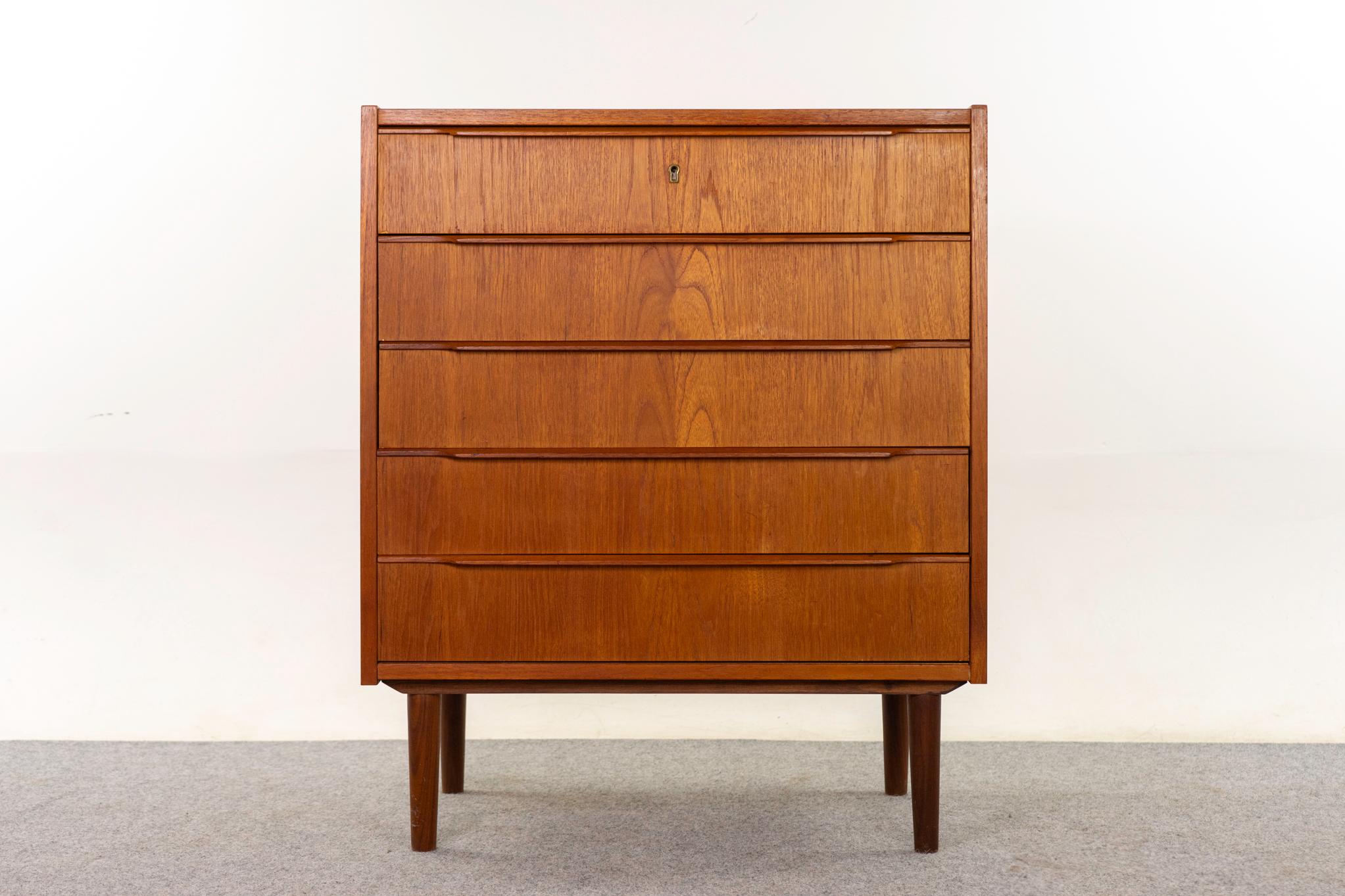 Teak Danish dresser, circa 1960's. Stunning book-matched veneer flat surfaces and solid wood edging. Integrated horizontal drawer pulls, dovetail construction, and robust tapered legs.

An unrestored item with the option to purchase in restored