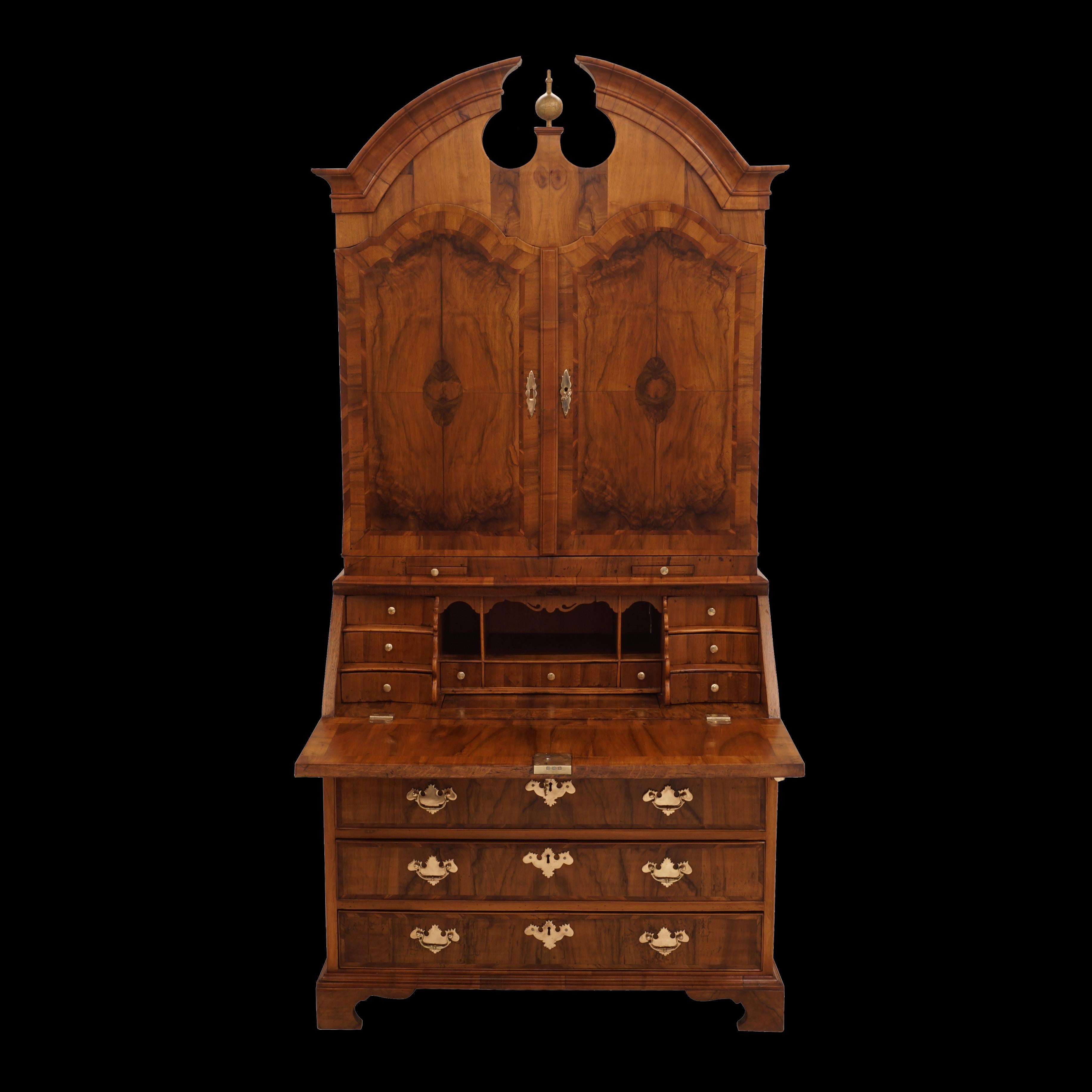 Mid 18th century baroque walnut venered Danish secretary
Upper section with two doors
Middle section with small drawers and a large hidden storage room for documents
Between the upper and middle sections plates for candle sticks
Lower section