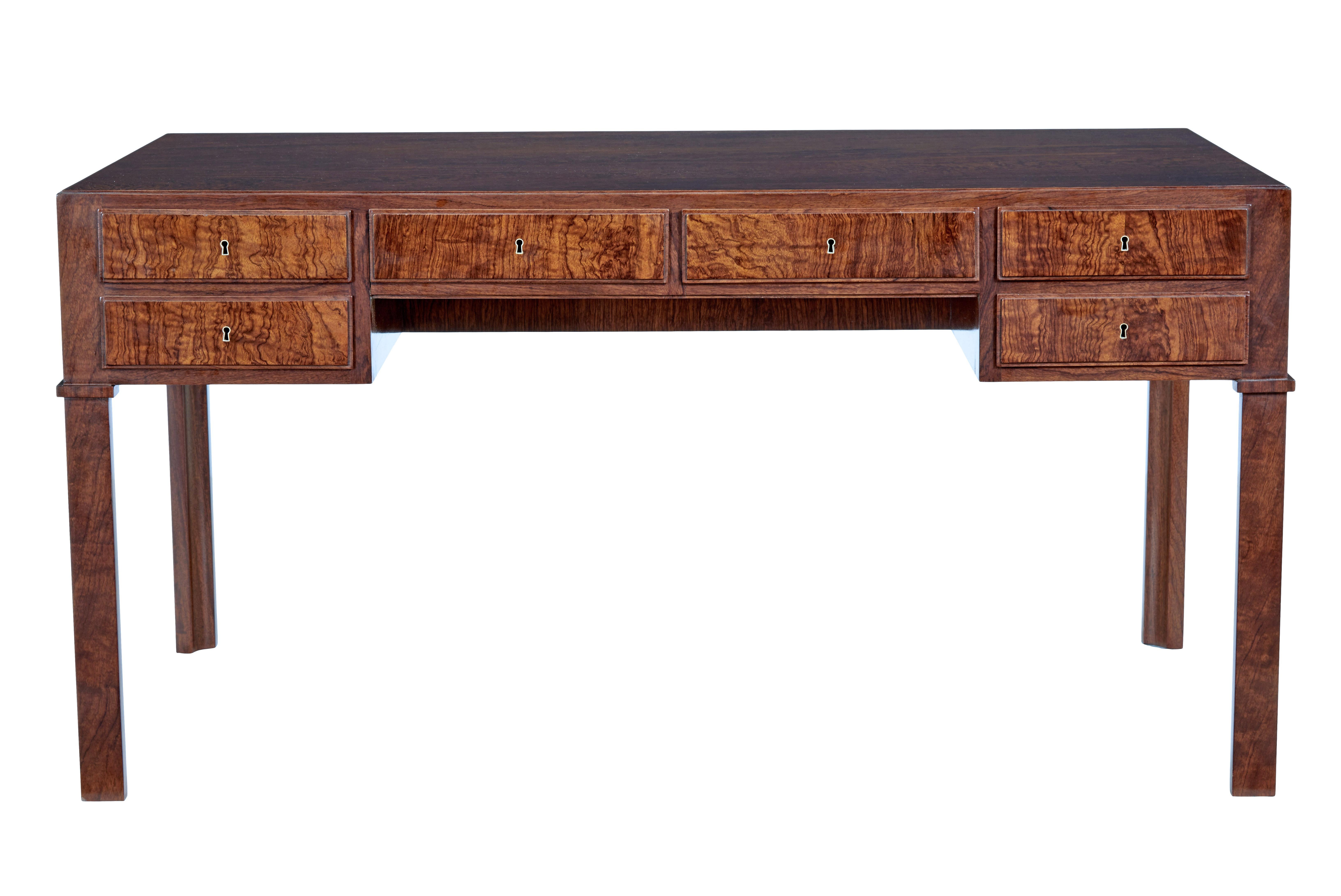 Danish mid 20th century burr walnut desk circa 1950.

We are please to offer this desk which is of the highest quality. 

Stunning top with a single veneer covering the whole writing surface. Veneered to the reverse making this desk free