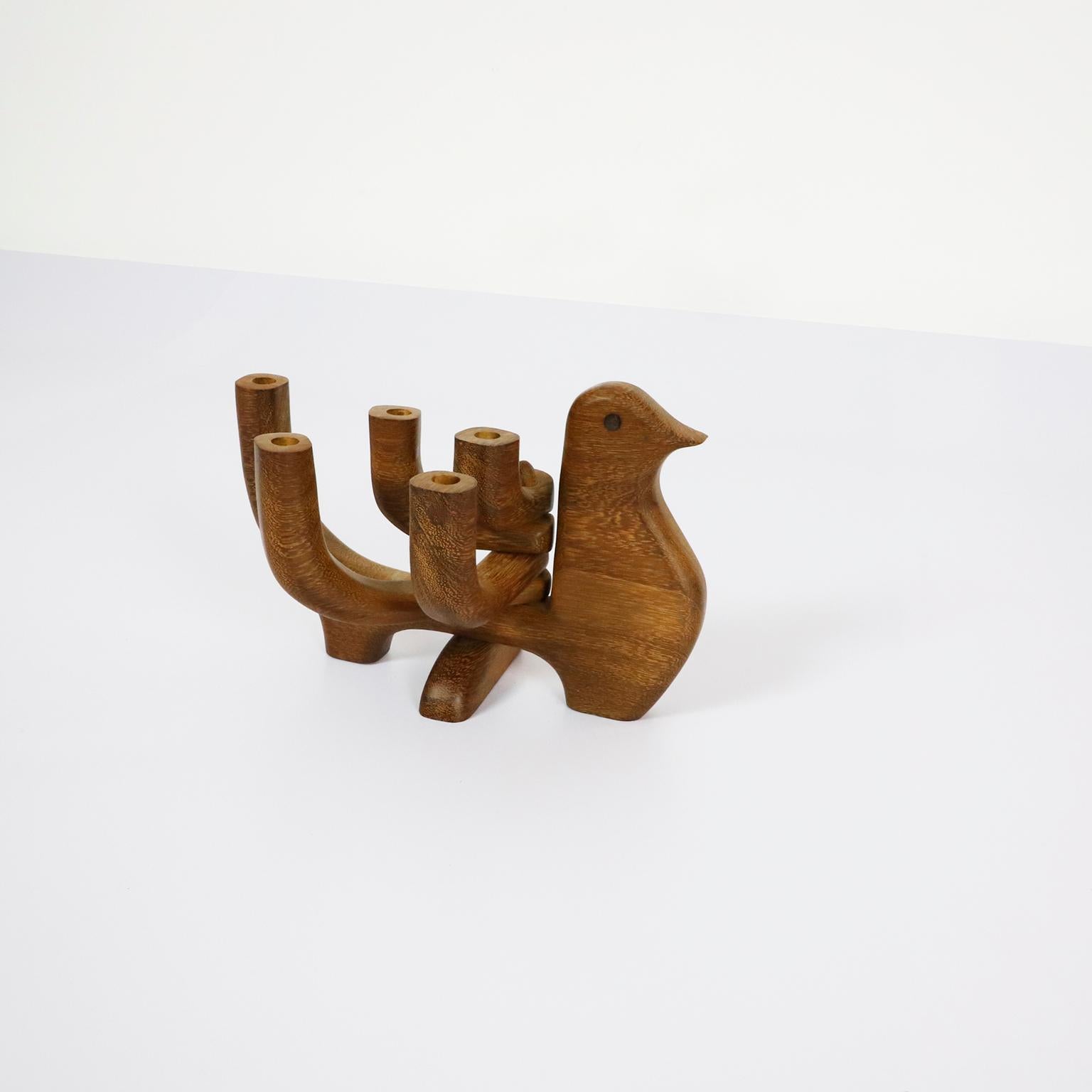 Circa 1960, we offer this Danish mid century 5 candle holder teak wood. This is a great danish bird shaped adjustable candle holder that holds 5 thin taper candles.