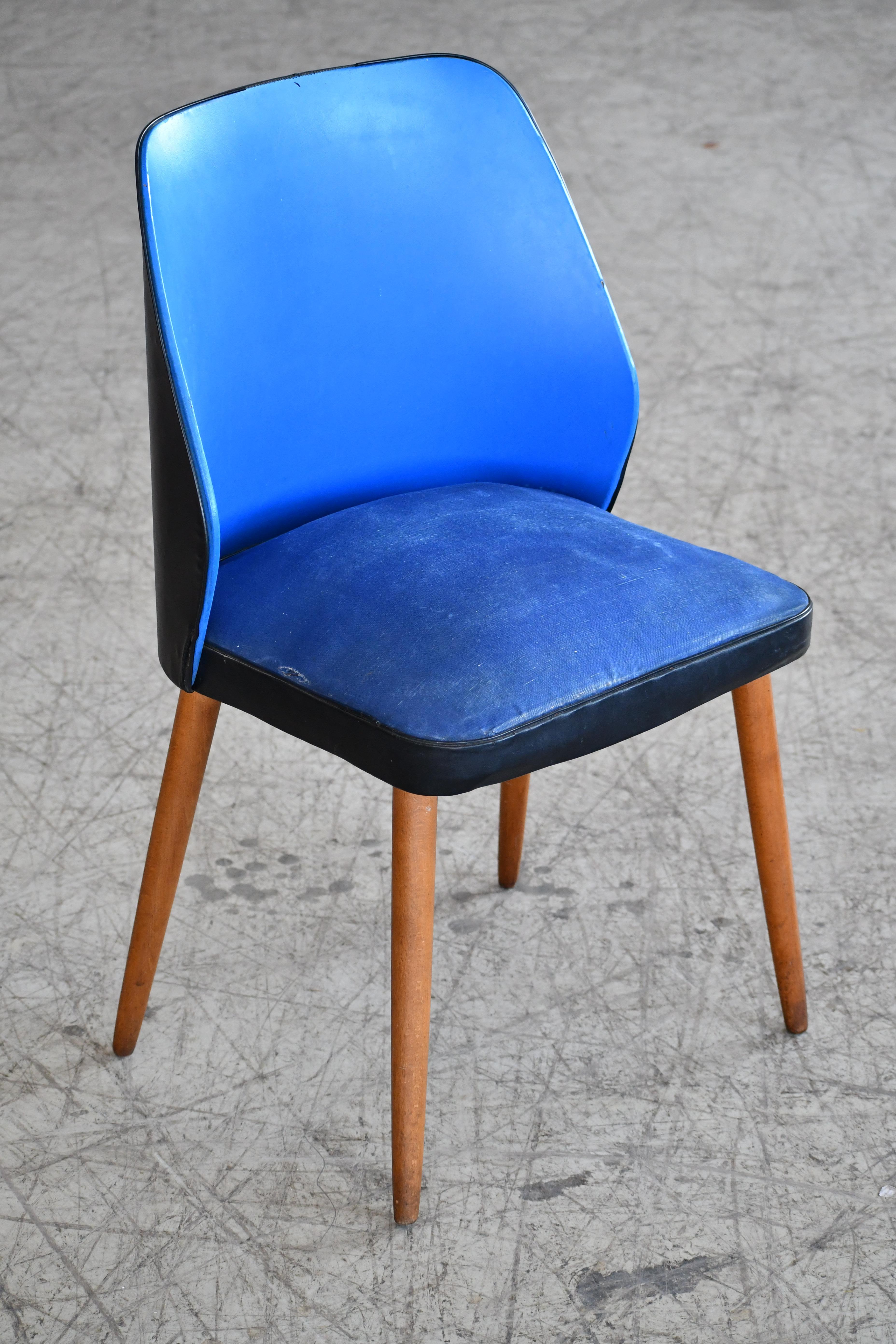 This is a great small vanity chair in the style of Frode Holm. For the person that already has everything, this may be the one thing to get. The chair is comfortable and supportive with a curved backrest. Light but sturdy. We are able to reupholster