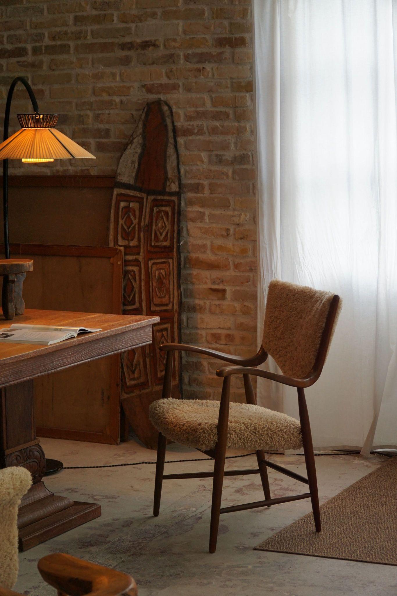 Armchair in beech with reupholstered seat & backrest in a great quality shearling lambswool. Made in the style of Danish designer Finn Juhl by a Danish Cabinetmaker in the 1950s. 
The chair is in a good vintage condition.

This classic desk chair