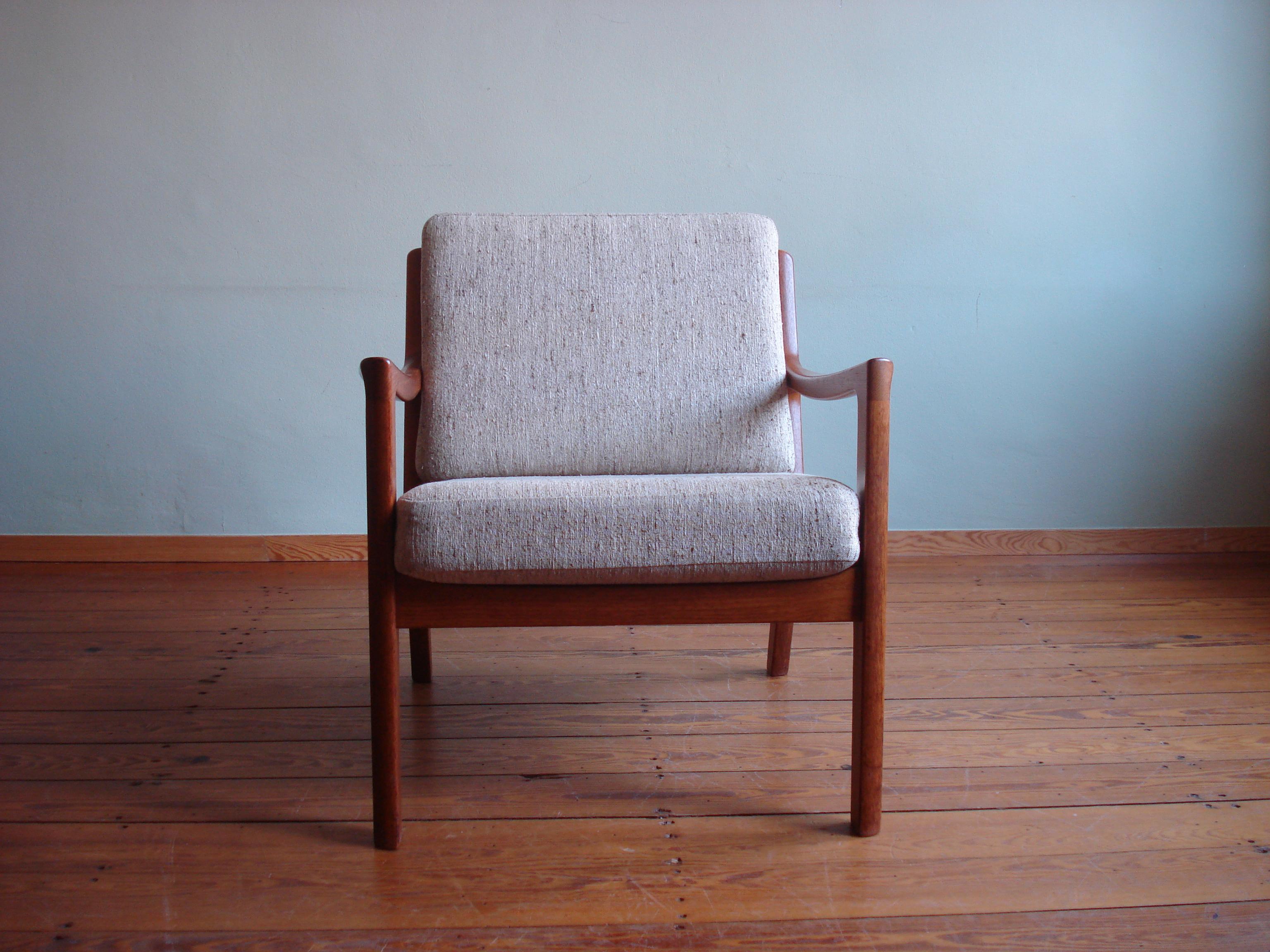 Beautiful Senator Armchair, designed by Ole Wanscher for Poul Jeppesen.
Made in Denmark and designed in the mid 50s. 

This version comes in solid teak wood with coarse, cream-colored cushions. 
Some minor scratches as pictured but in very nice