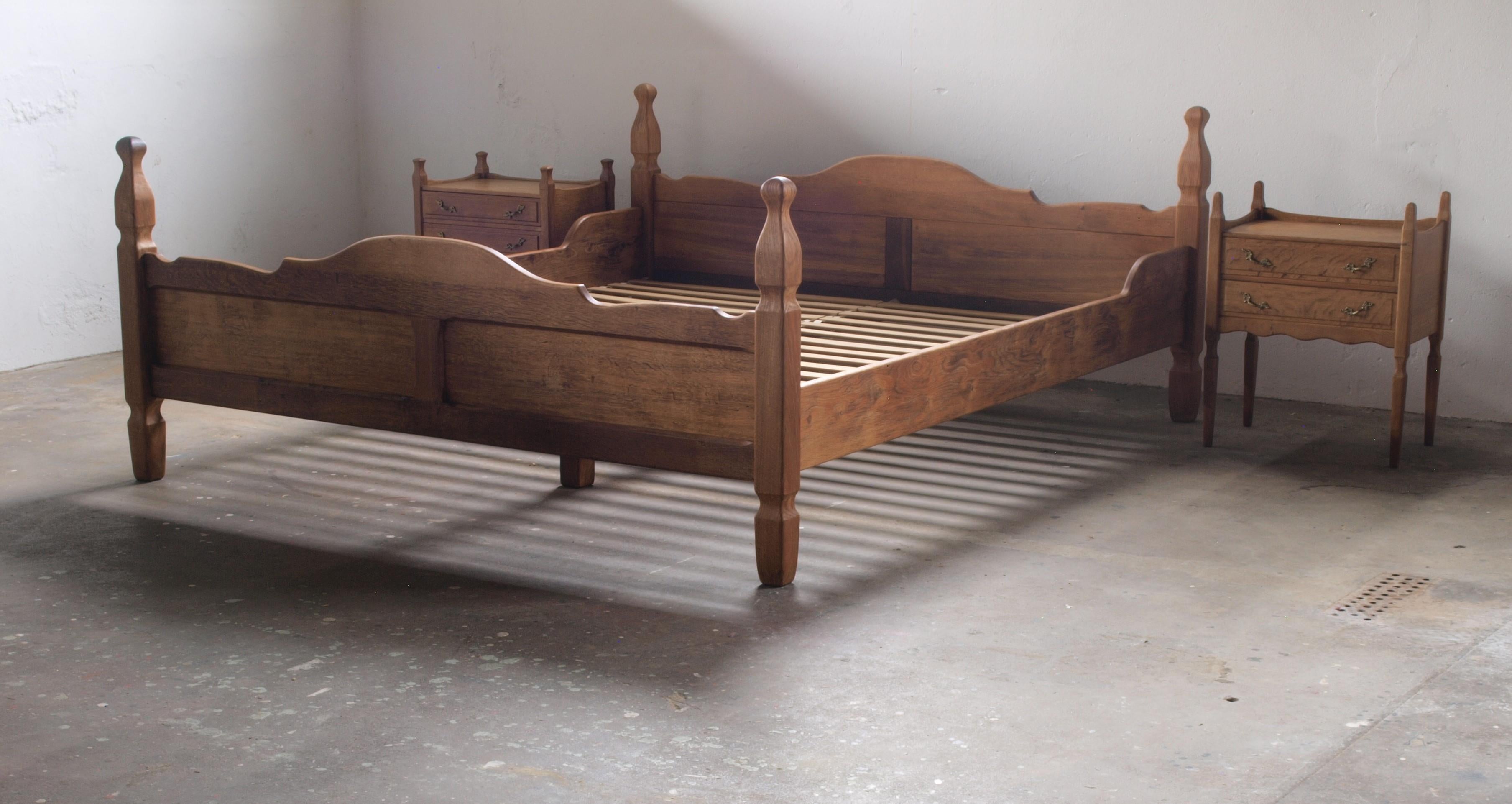 A rare double bed in solid oak. Design attributed Henning Kjærnulf for EG Møbler, Denmark, made around the 1960s. A sculptural piece that combines Baroque style and modernism.

Measure 39cm from floor to the top of the surface of the matress. This