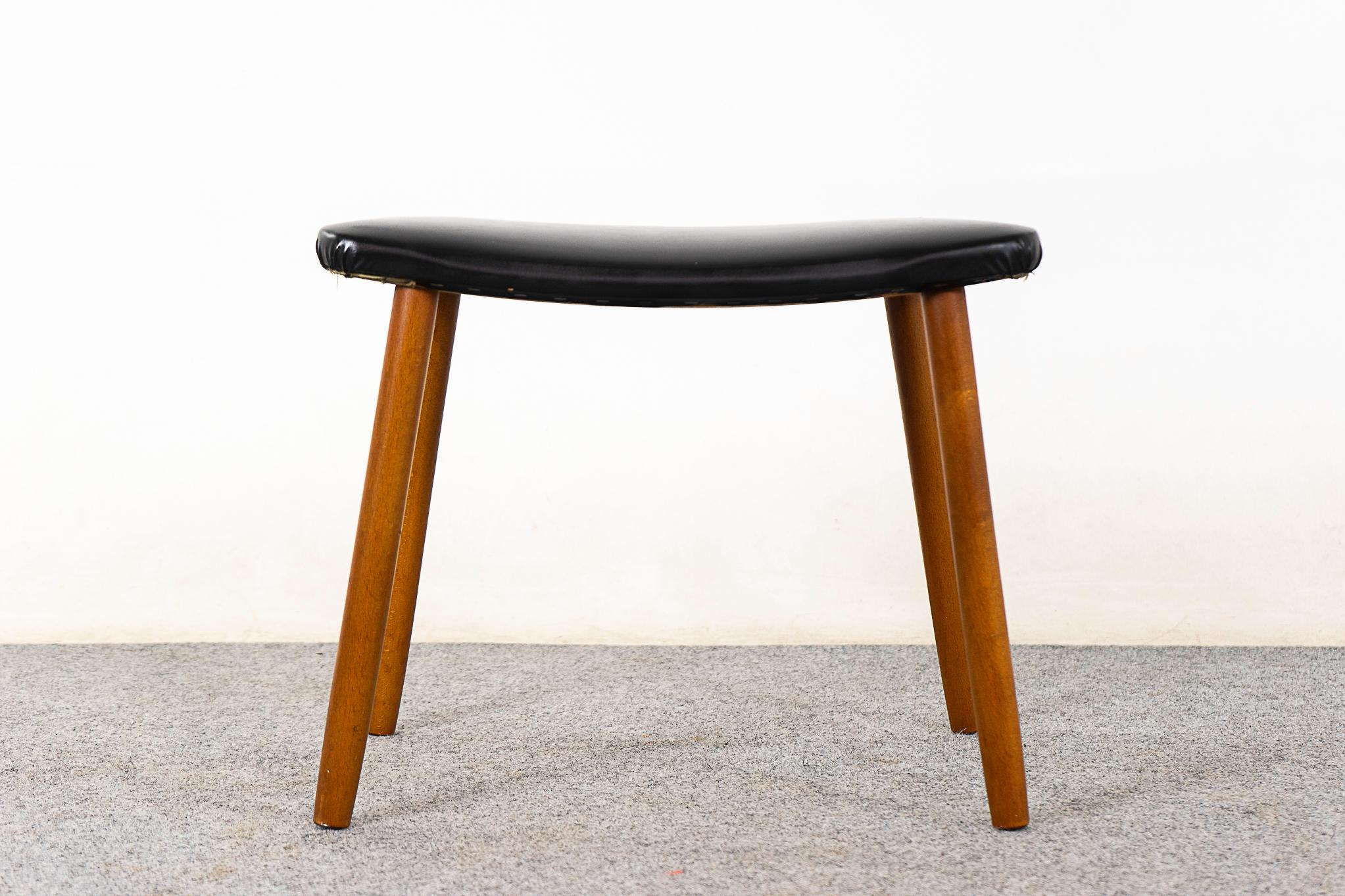 Beech footstool, circa 1960's. Removable legs and original vinyl with minor wear and tear.