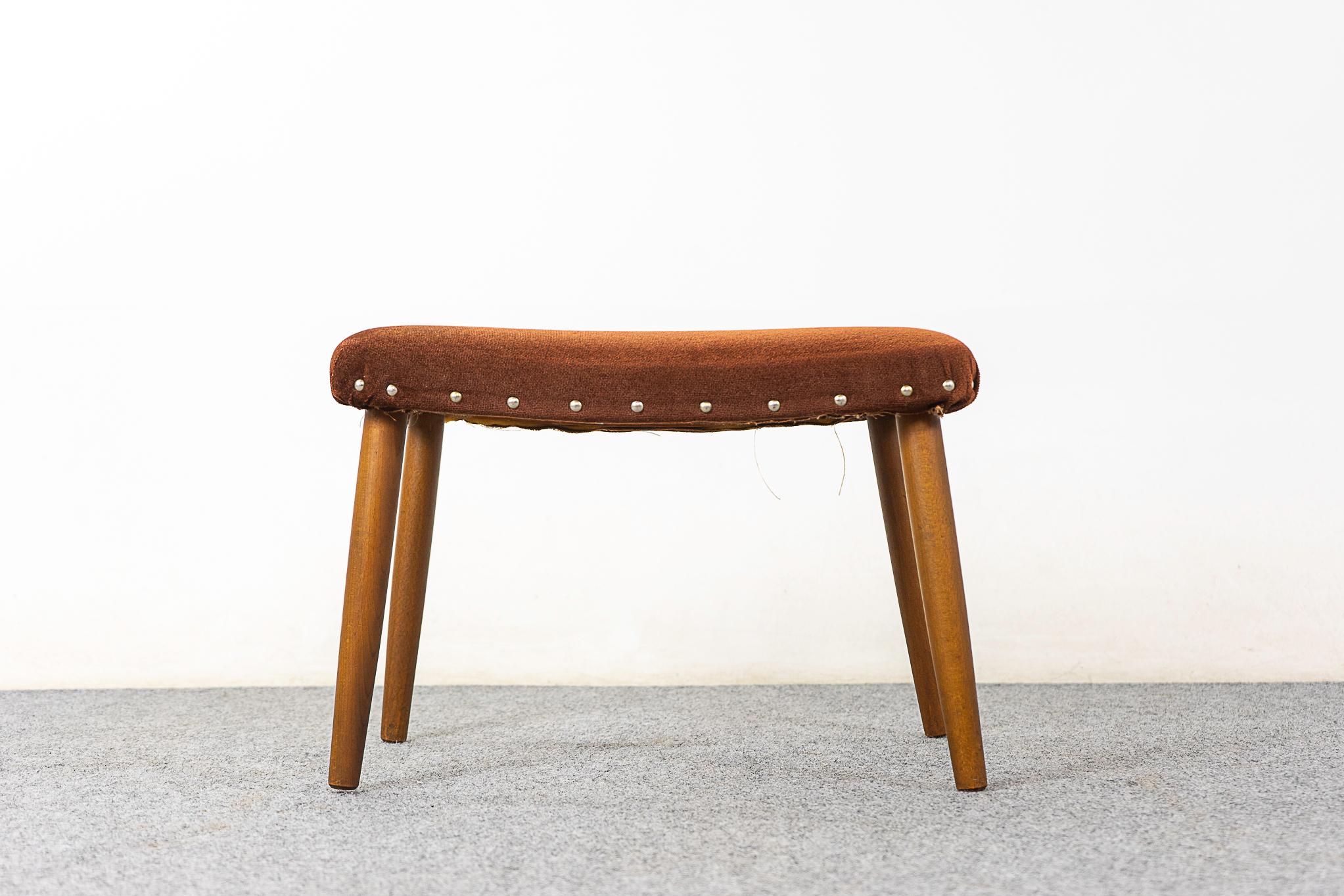 Beech Danish footstool, circa 1960's. Slender spayed legs and original upholstery with wear & tear. 