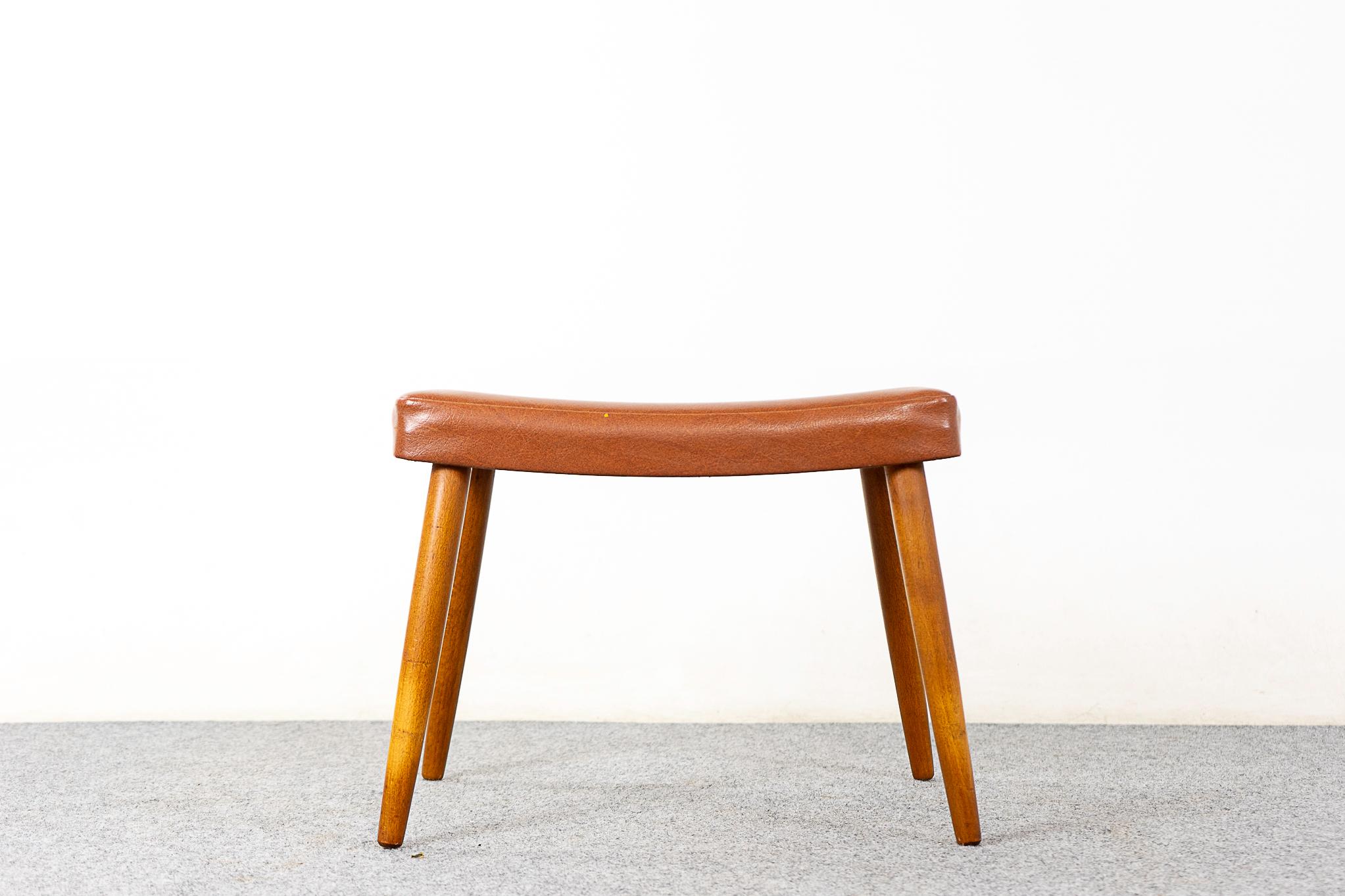Beech Danish footstool, circa 1960's. Original vinyl upholstery with wear.
