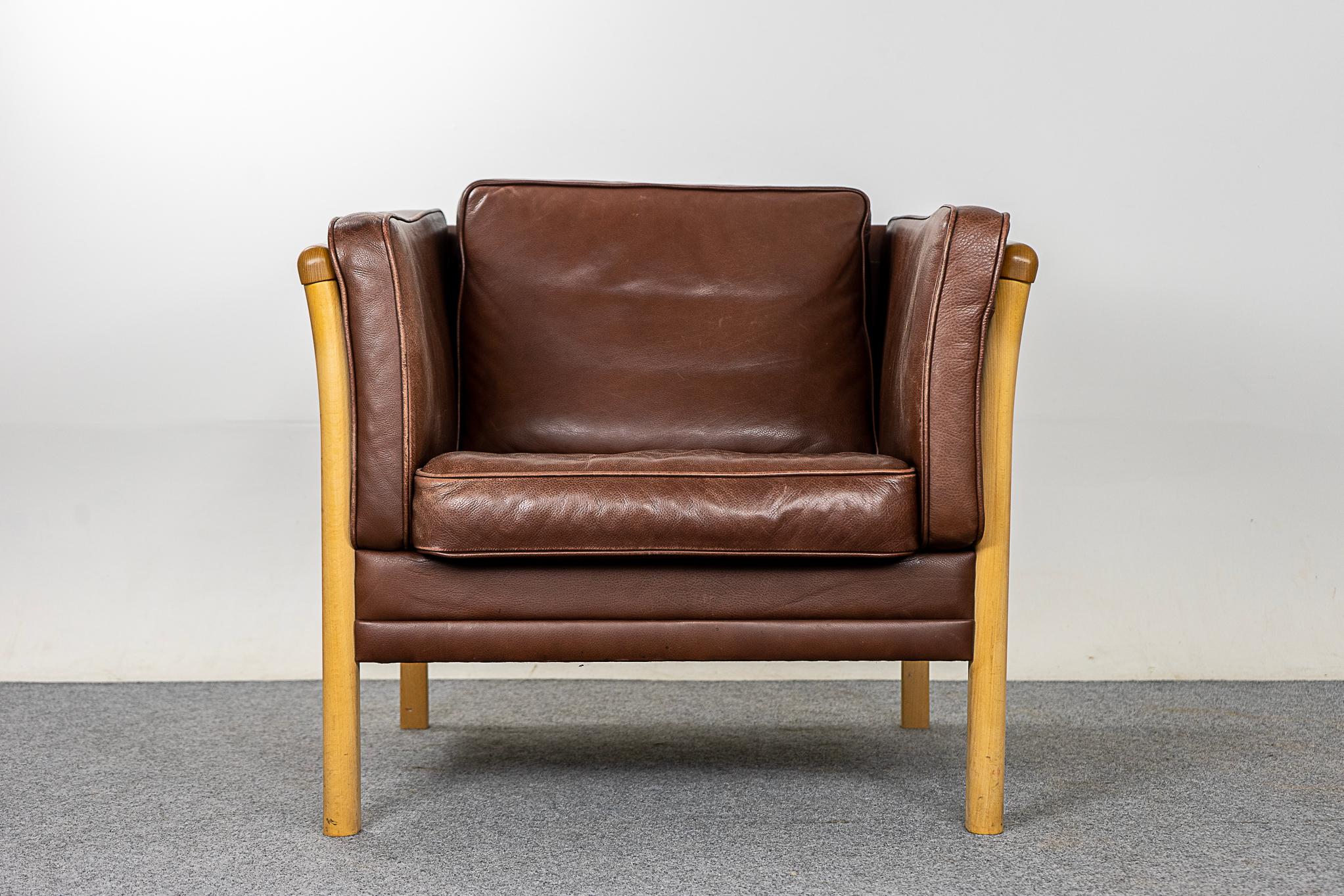 Beech wood & leather Danish lounge chair, circa 1960's. Clean modern solid wood frame with unique slatted sides with a slight bow shape. The leather cushions have the perfect amount of patina, some wear on the seat.  Chillax!   

Please inquire for