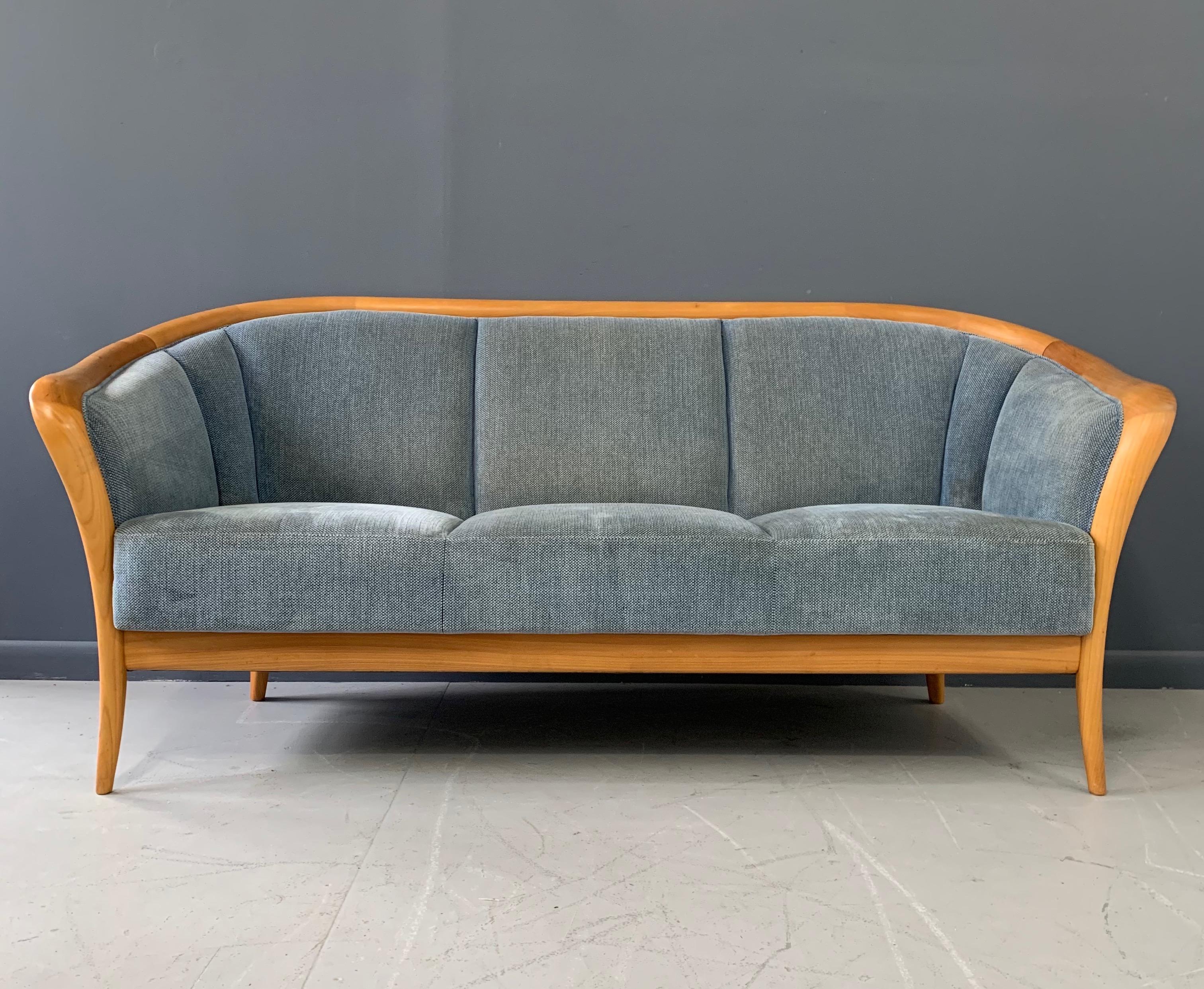 Petite sofa in birch with extraordinary joining and wonderfully curved arms would be a wonderful addition to your apartment style living. 

The fabric on this sofa could use replacement, we would be happy to reupholster this sofa with your fabric
