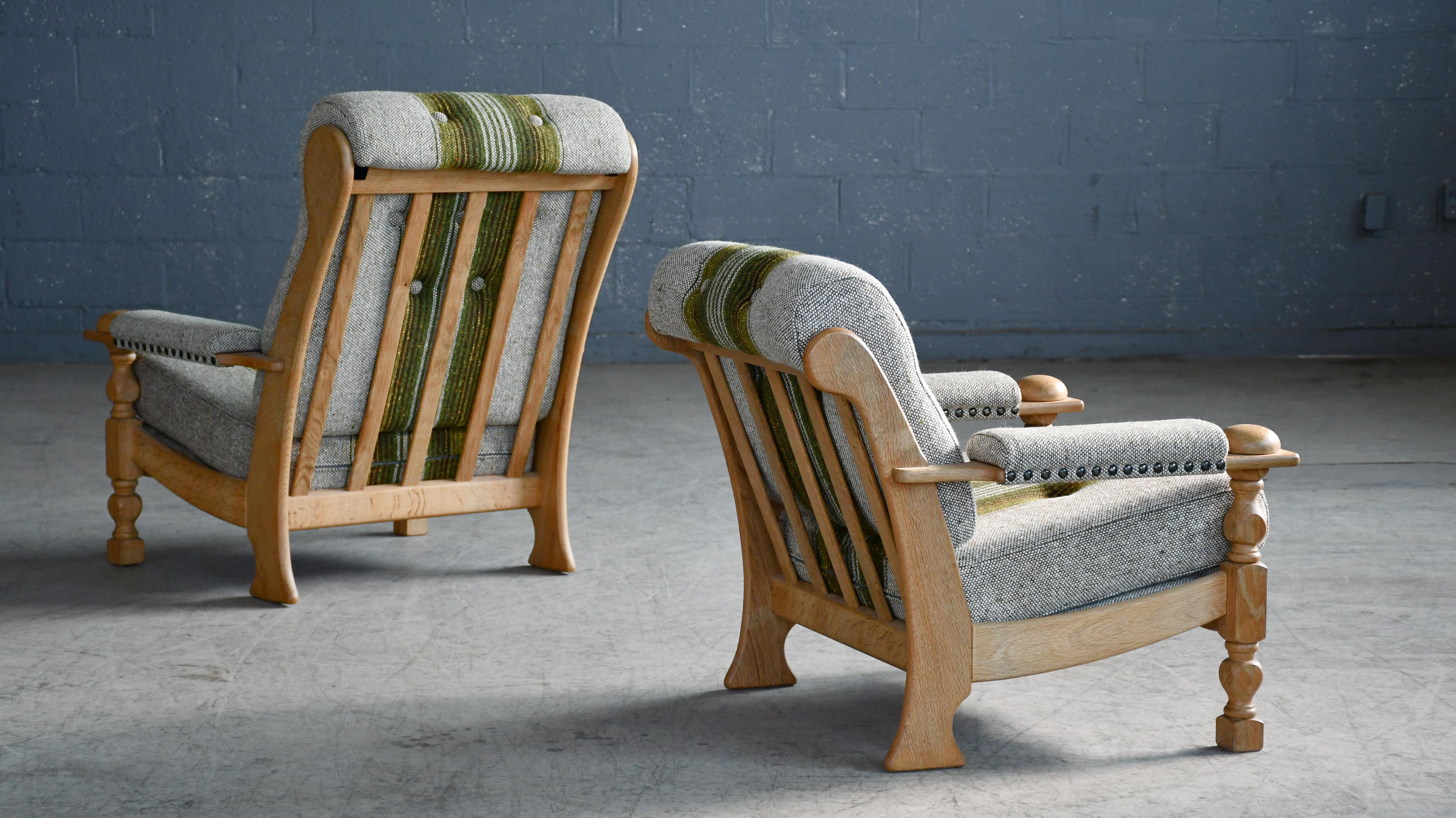 Very cool sought after pair of  easy chairs by Danish Designer, Henning (Henry) Kjaernulf made from quarter-sawn white oak and hand carved in a brutalist style inspired to art & crafts and even Jacobean styles. Kjaernulfs style is very unique and
