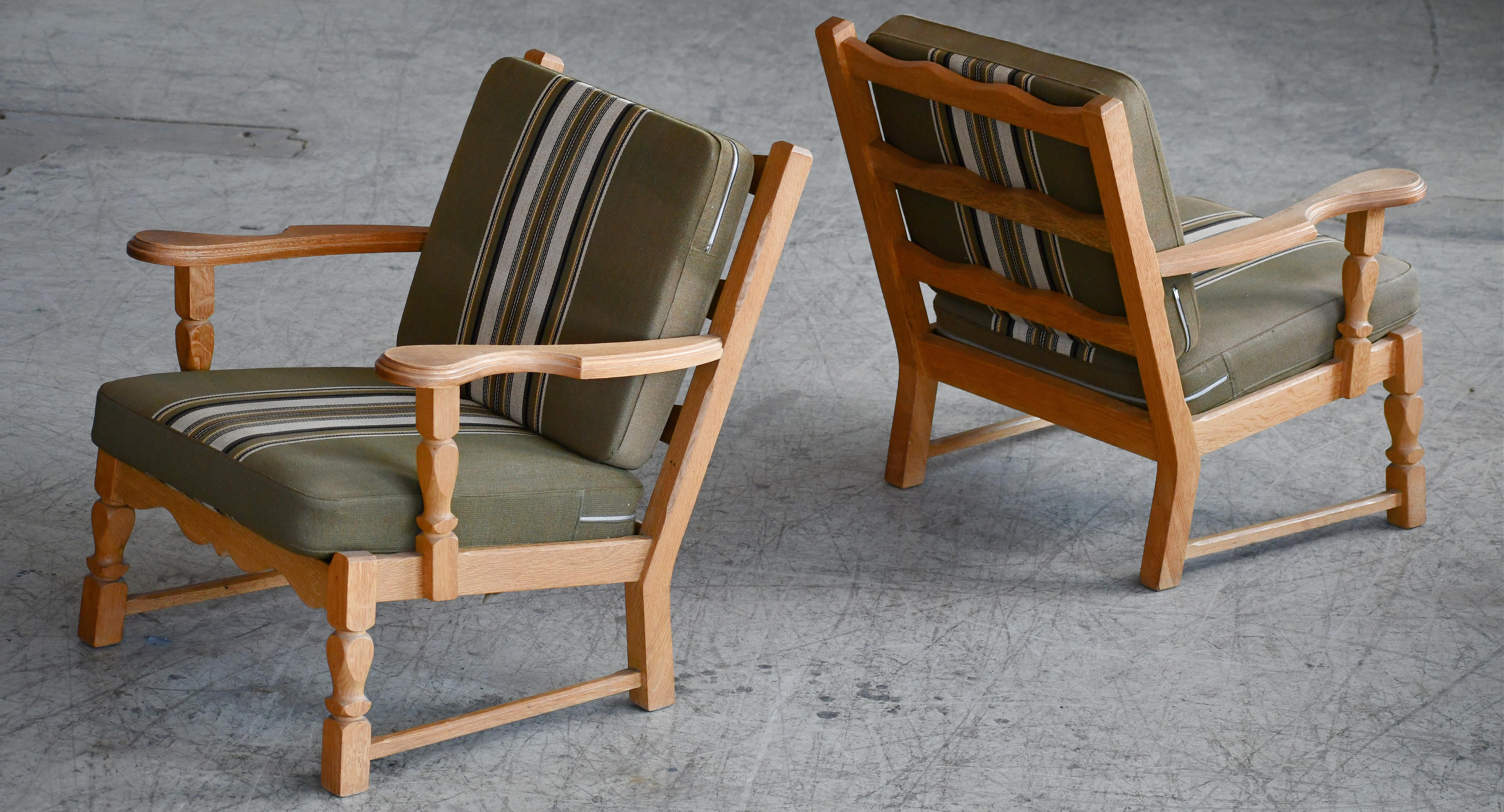 Coveted pair of  lounge chairs by Danish Designer, Henning Kjaernulf made from quarter-sawn white oak and hand carved in brutalist style. Kjaernulfs style is very unique and instantly recognizable and was quite popular in Denmark during the very