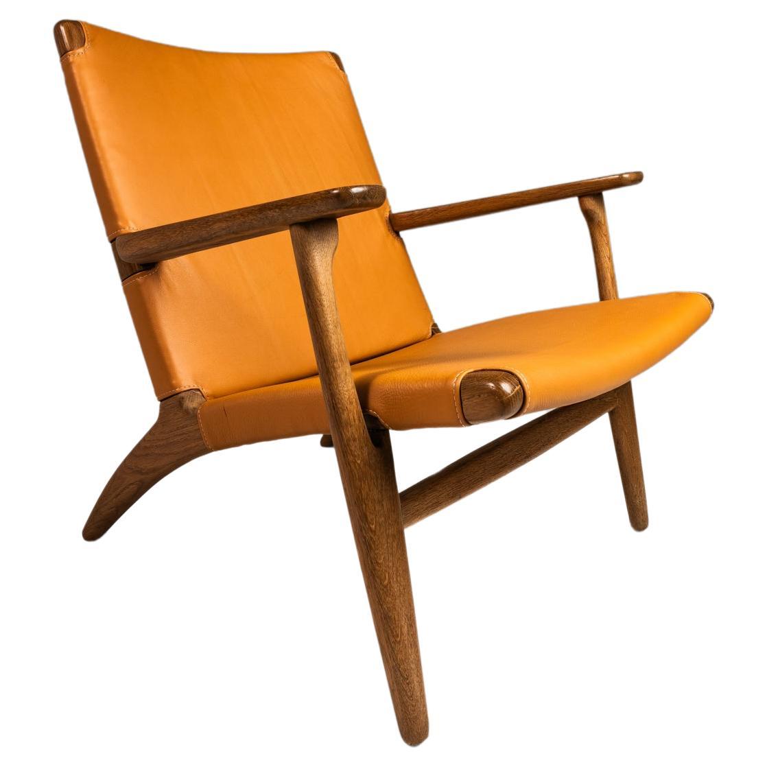 Danish Mid-Century CH 25 Lounge Chair by Hans J. Wegner, Oak & Leather, c. 1950 For Sale