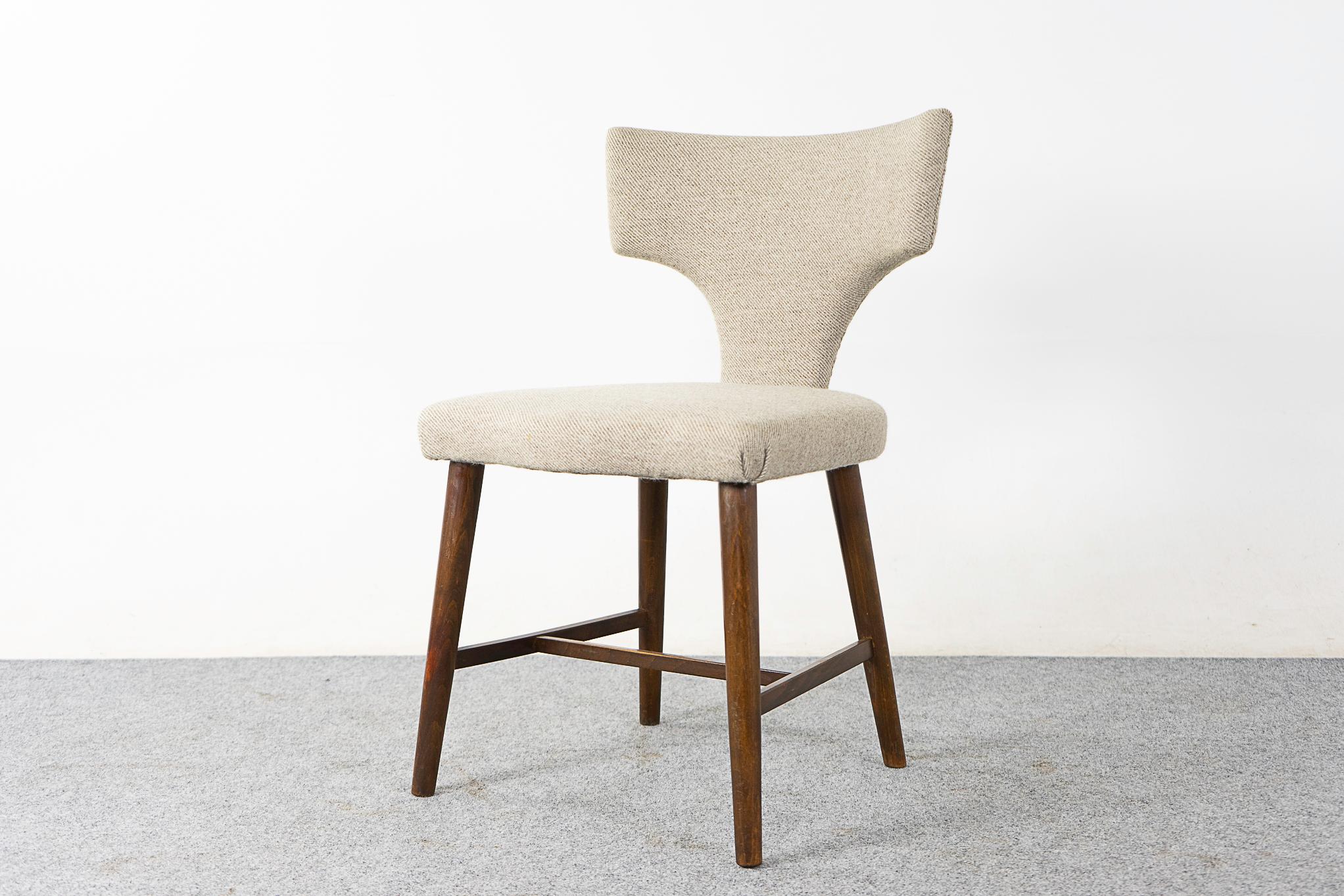 Beech wood chair, circa 1960's. Perfectly petite, darling striking profile with original cream upholstery with minor wear. Would work great with a vanity! 

Please inquire for a remote and international shipping rates.