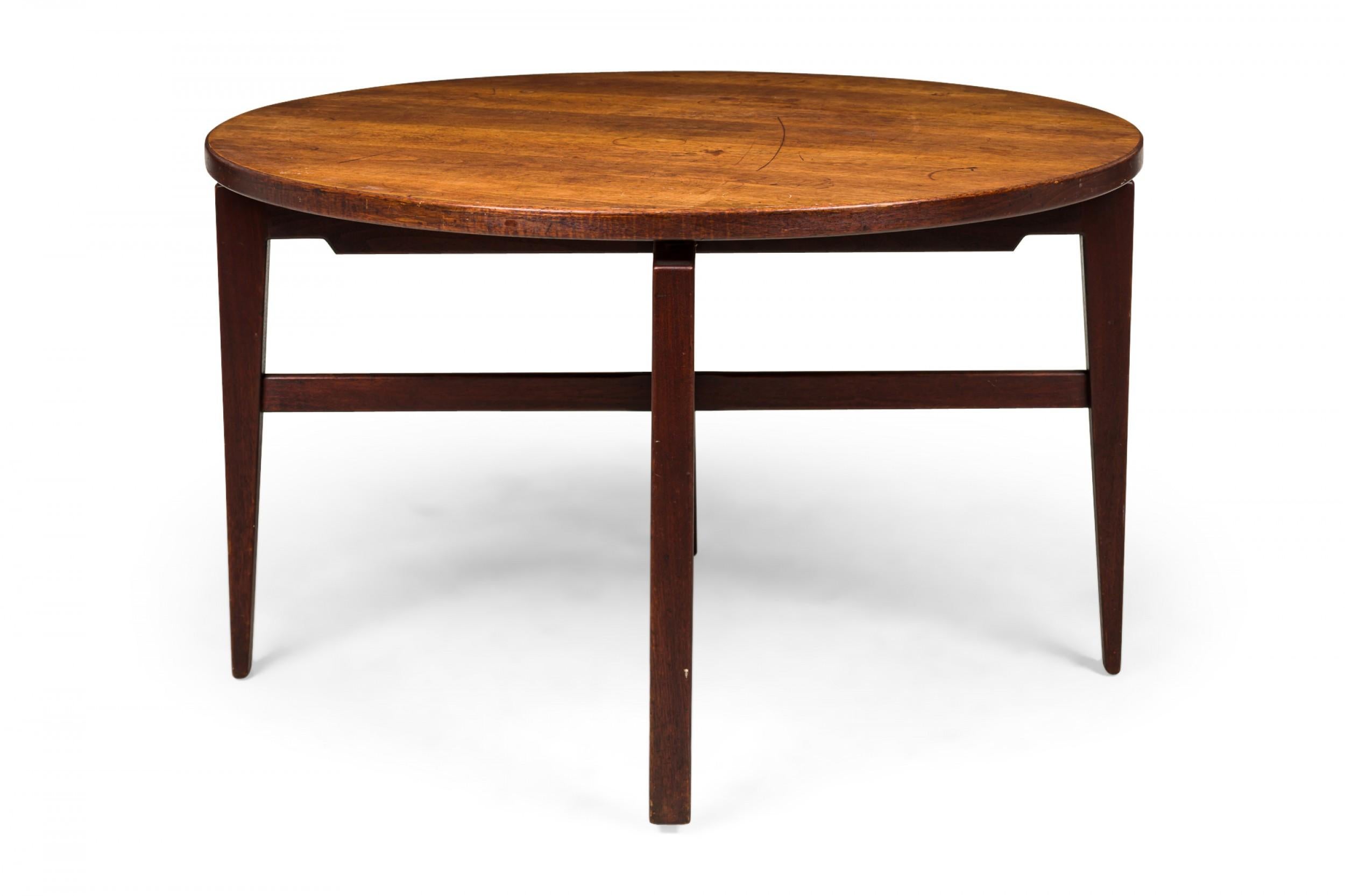Danish Mid-Century circular walnut dining table with a rotating lazy susan top resting on an X-shaped walnut base with tapered square legs. (JENS RISOM)(Similar tables: DUF0276, DUF0278, DUF0279)
