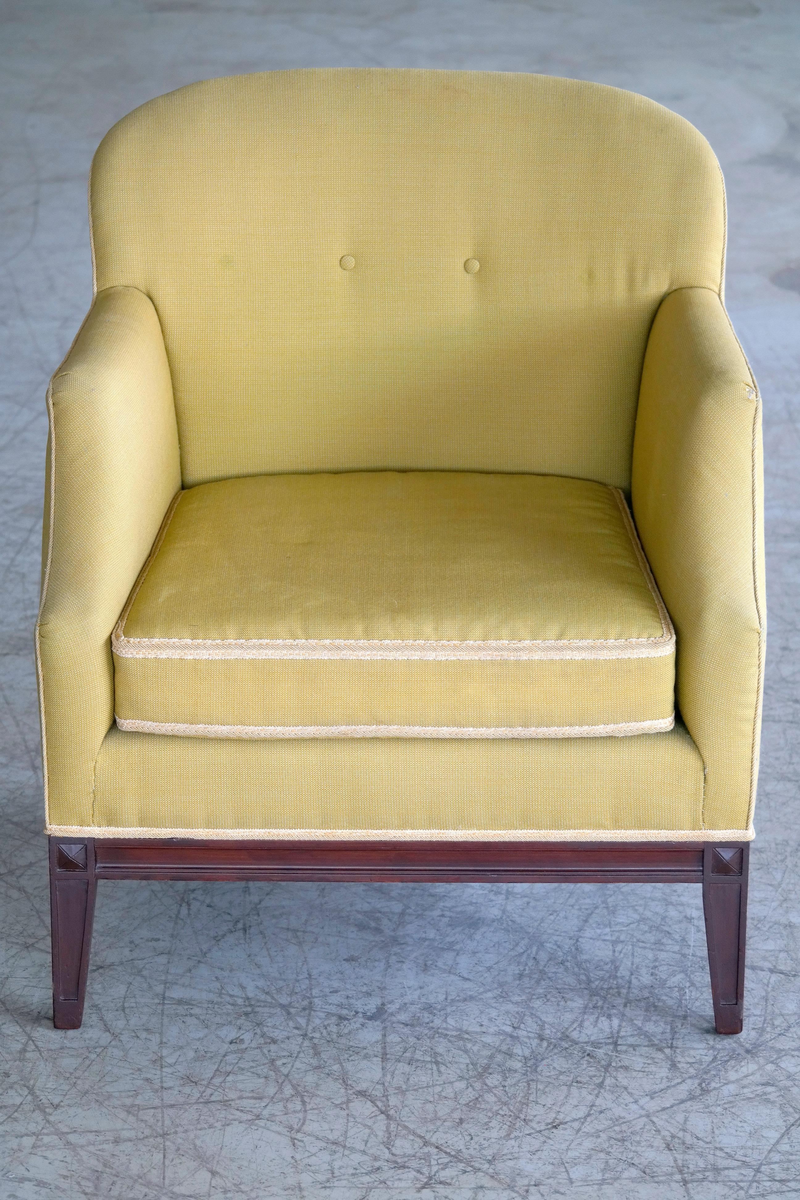 Danish 1950s classic lounge chair by Master Carpenter, Georg Kofoed of Copenhagen. This lounge chair is a very fine example of Georg Kofoed's style and high level of execution. Elegant well proportioned lines made raised on a base of nicely carved
