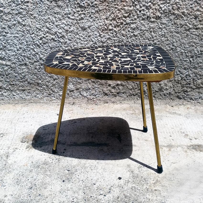 Danish midcentury coffee table or plants holder with mosaic top, 1960s
Danish coffee table with irregular shape, mosaic top and brass legs from Sixties.
Very good condition.
Measures: 38 x 20 x 32 H cm.