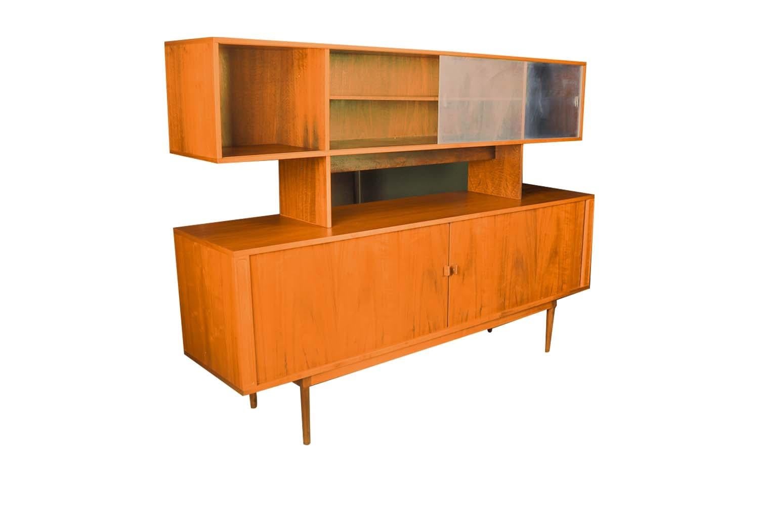 Remarkable, teak, stunning tambour door, two-piece hutch credenza made by Lovig in Denmark and designed by the renowned Jens Quistgaard (April 23, 1919 – January 4, 2008) most famous for his iconic designs for Dansk Designs (Kobenstyle cookware,