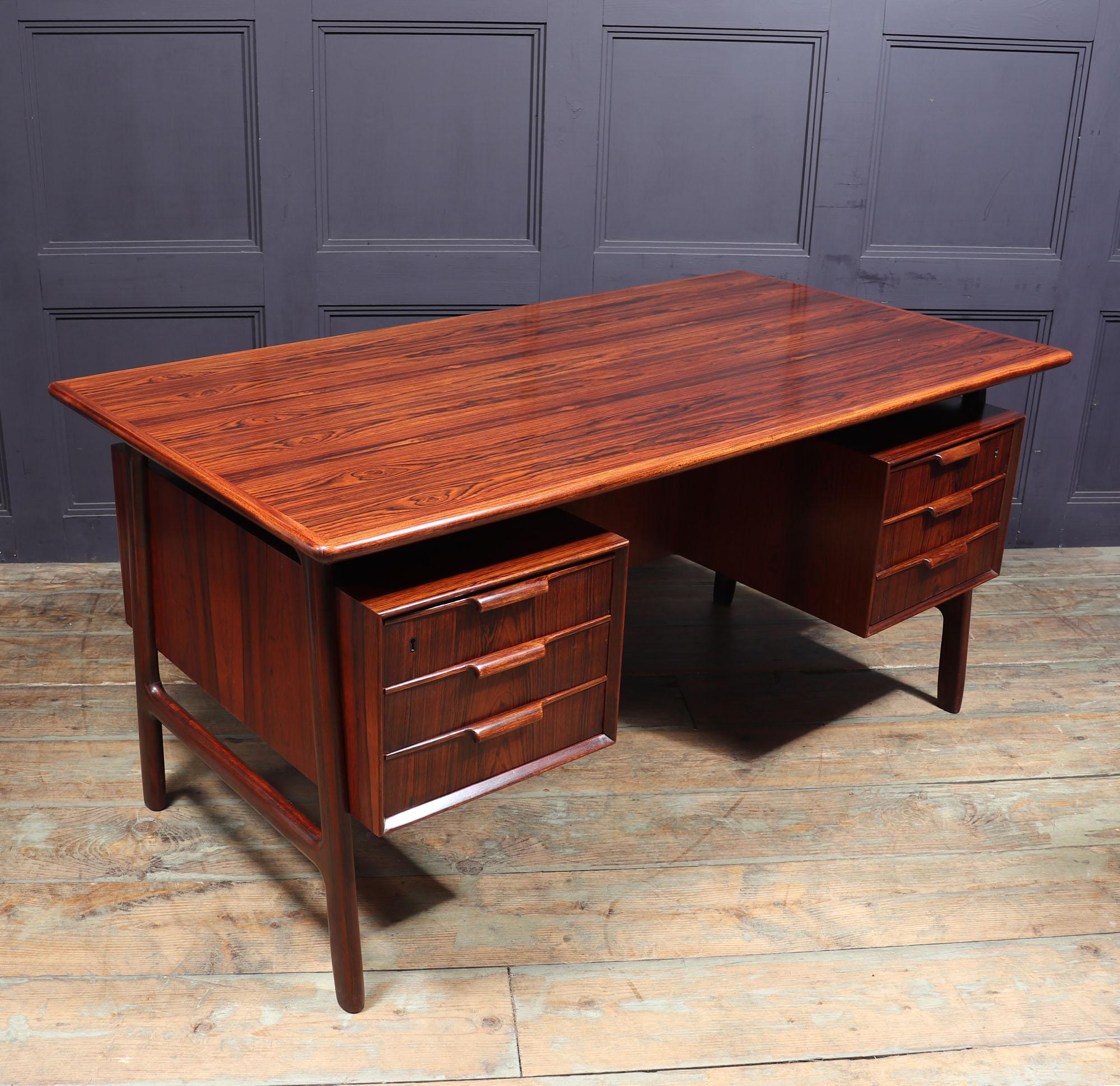 Midcentury desk - Omann Jun - Model 75
A freestanding desk designed and produced in Denmark by Omann Jun in the mid 1960’s, this example being the desirable model 75 in rosewood with floating top, it has six drawers to the front and a bookshelf to