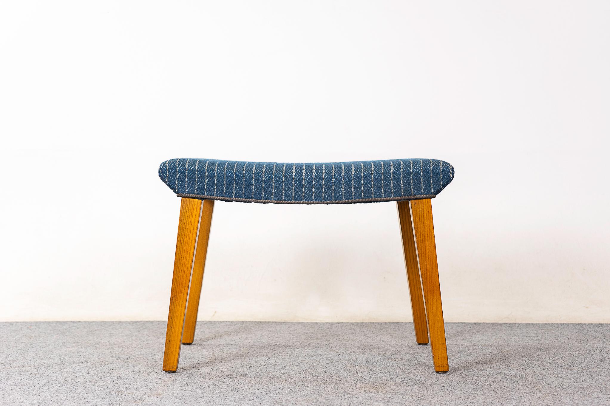 Elm footstool, circa 1950's. Spayed legs and original upholstery with minor wear and tear. 