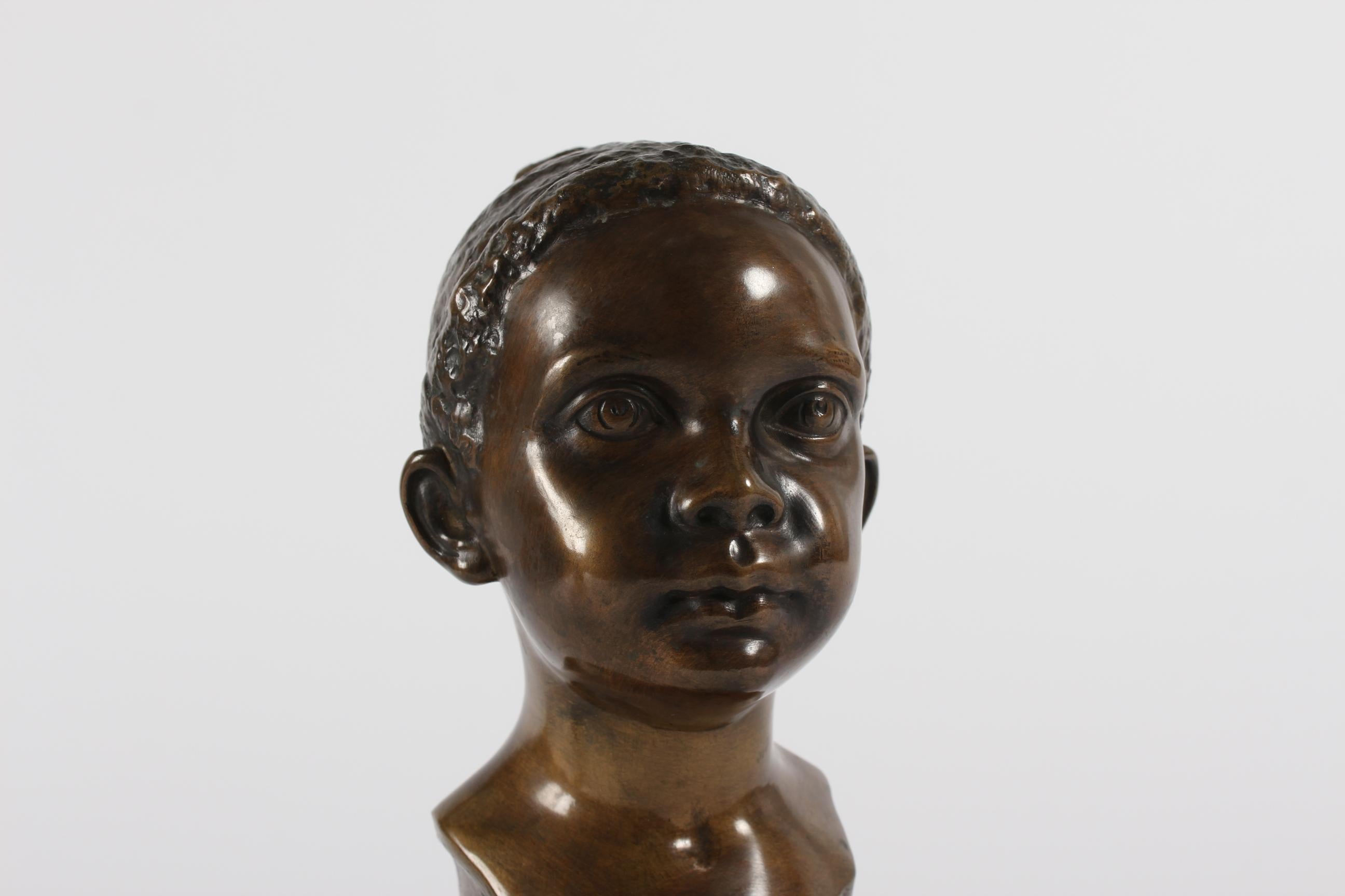 Original midcentury bust of young child designed by Danish artist and sculptor Elna Borch (1869-1950) made of bronze with brown patina.
It was manufactured circa 1940s or 1950s by bronze foundry L. Rasmussen in Copenhagen.

Sign. E. Borch + stamp