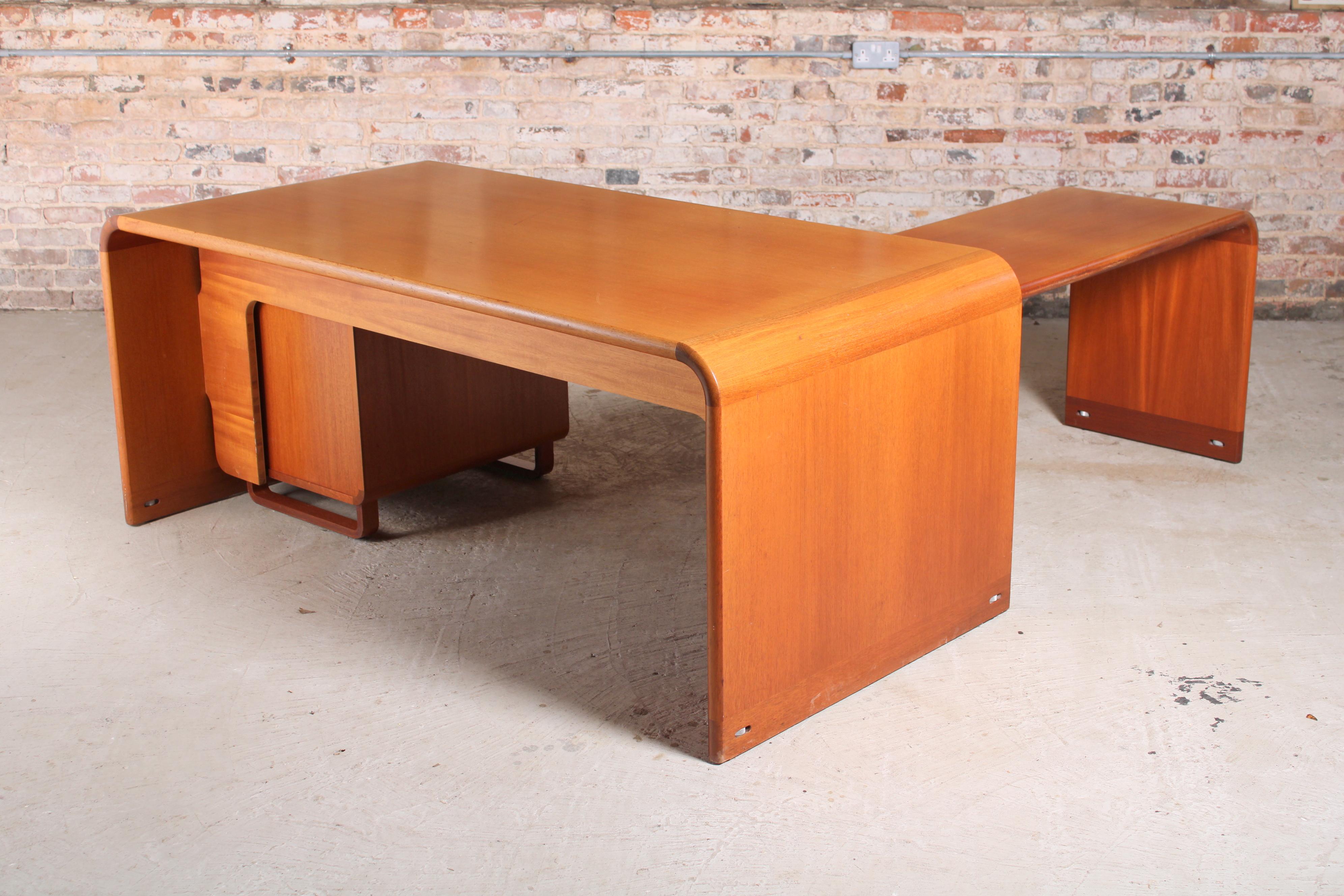 Danish mid century executive teak corner desk by Rud Thygesen & Johnny Sorensen, circa 1970s. Standalone chest of 5 drawers. The return section can be fixed in multiple positions, so the depth can vary from 150-207cm. Height adjustable feet.