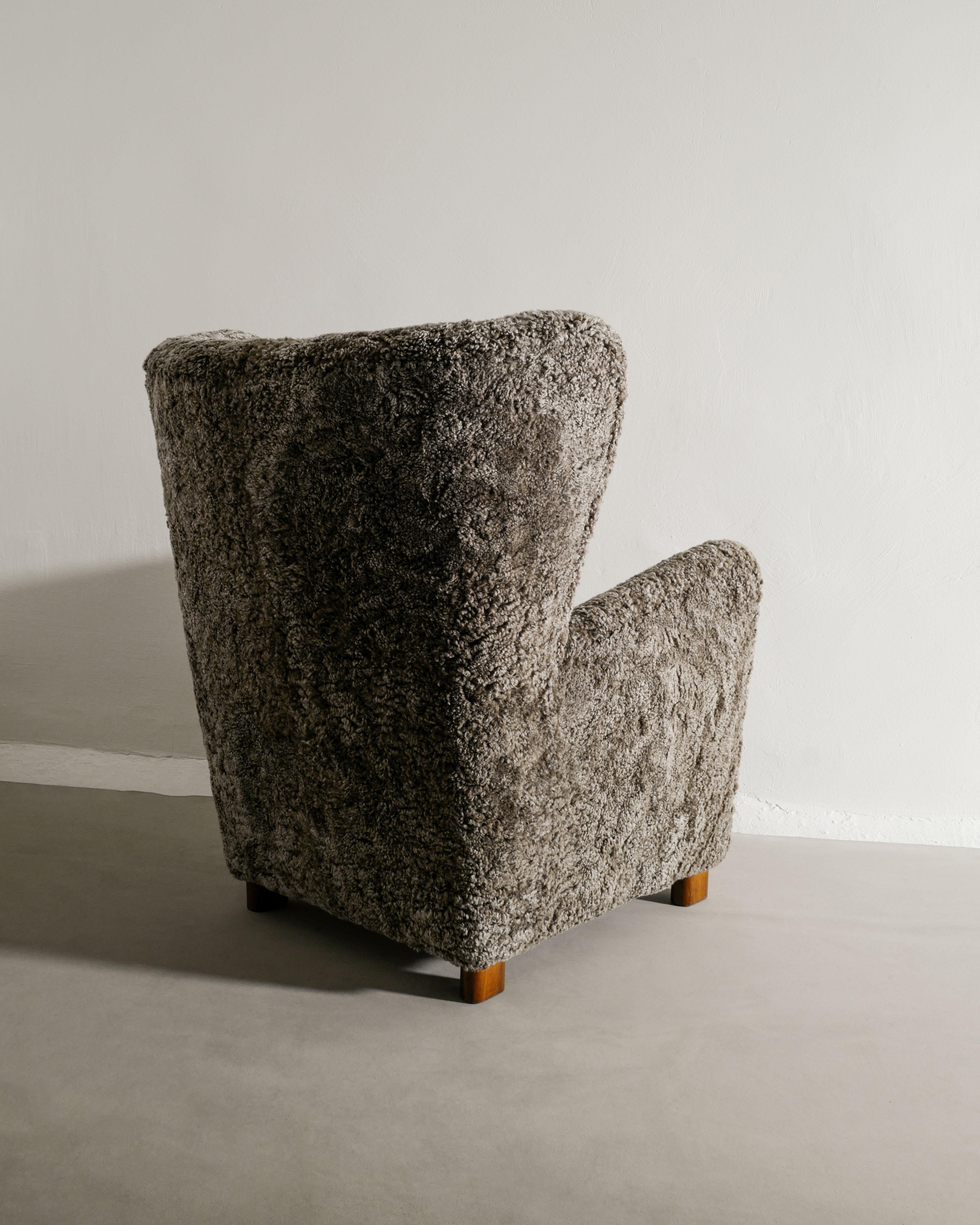 Scandinavian Modern Danish Mid Century Highback Wingback Armchair in Grey Sheepskin Produced, 1940s For Sale