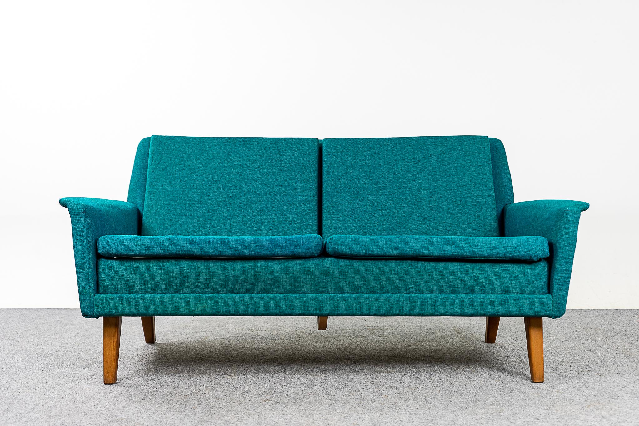 Beech wood Danish loveseat by Fritz Hansen, circa 1960s. Clean modern lines and contrasting solid beech legs. Original teal fabric shows wear & tear.

Please inquire for international shipping rates.