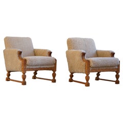 Paire de fauteuils de salon danois modernes du milieu du siècle dernier, en chêne et laine d'agneau, années 1950